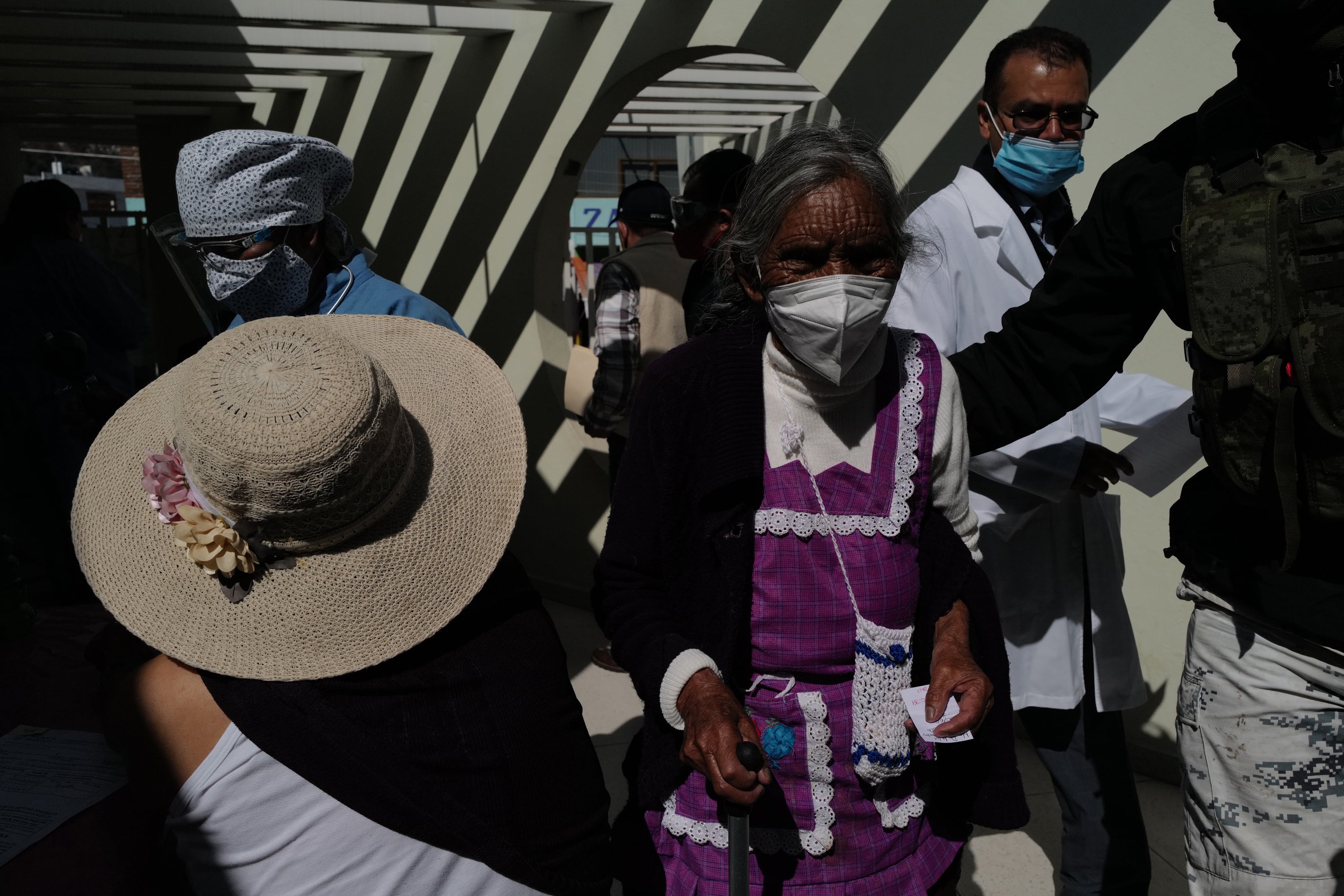 Maria de la Luz Sanchez, 80, is taken to be vaccinated