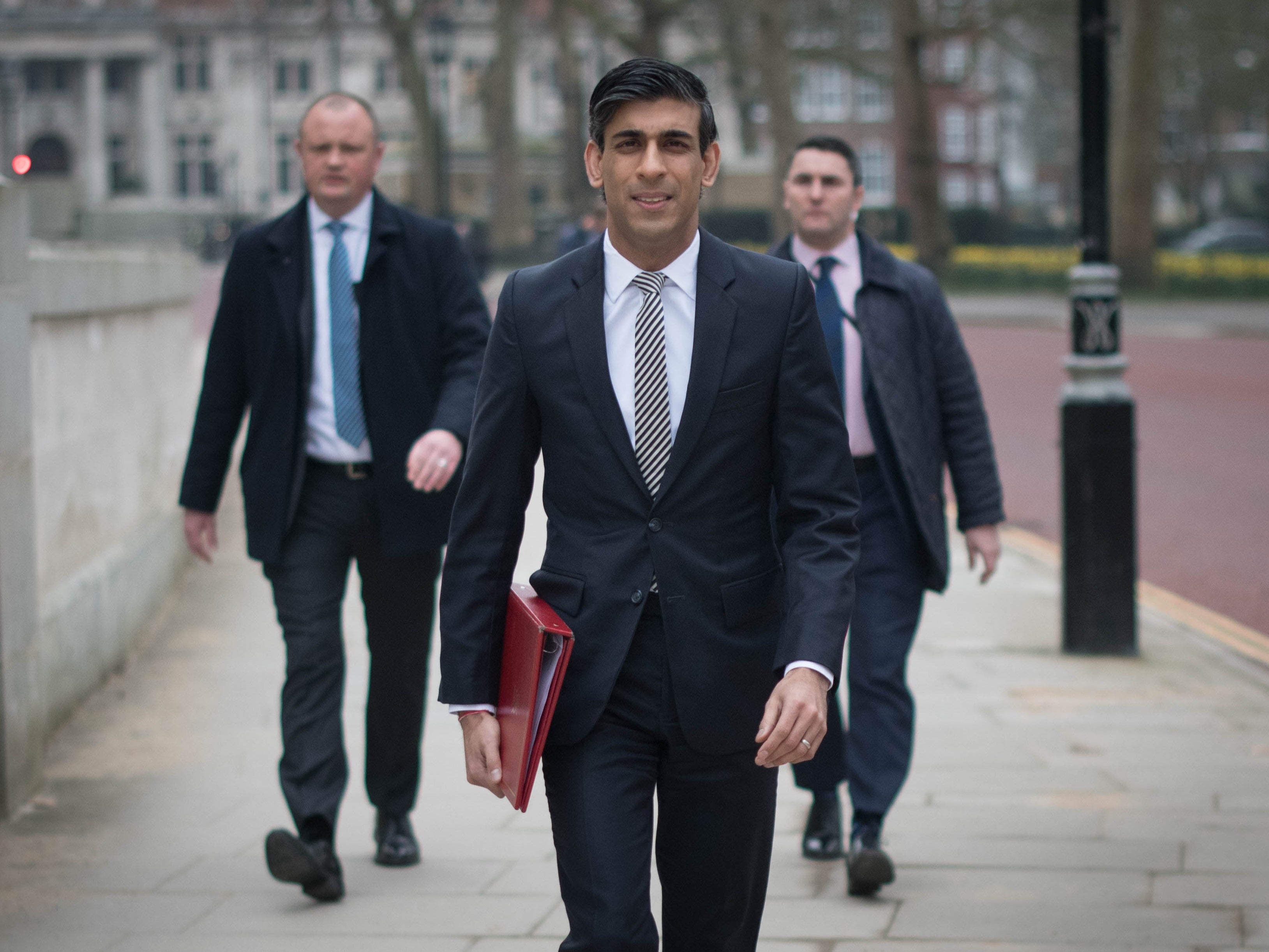 Chancellor of the Exchequer, Rishi Sunak, walks from the Treasury to No 11 Downing Street, London, the day before delivering his budget