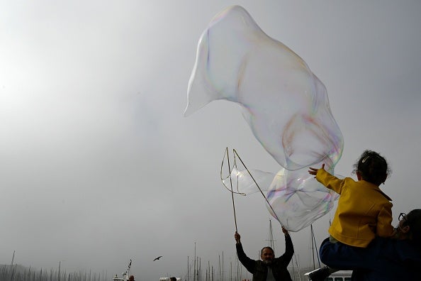 Representative: A girl playing with soap bubbles