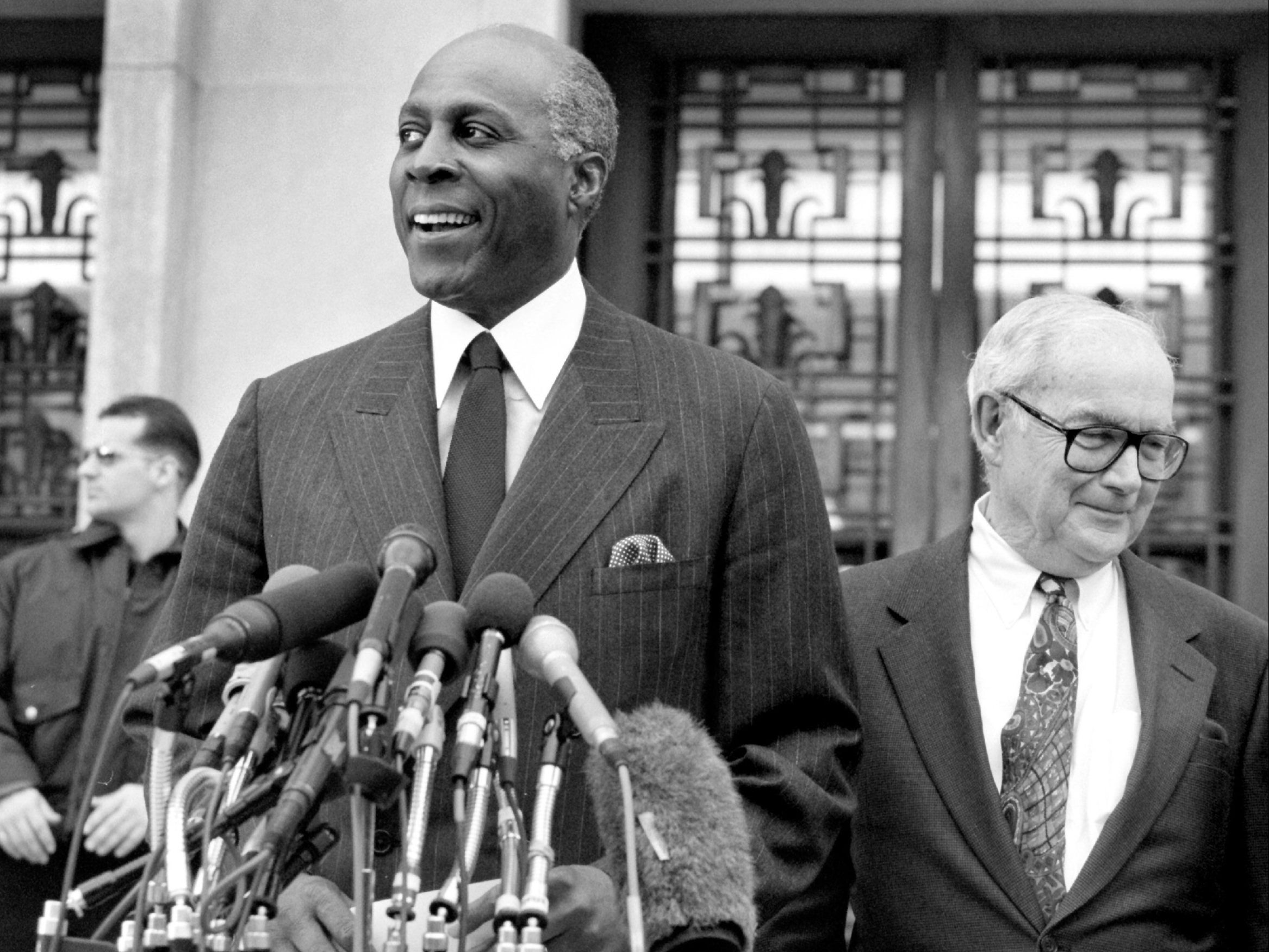 Jordan (left) exits a courthouse in Washington after testifying before a grand jury in 1998