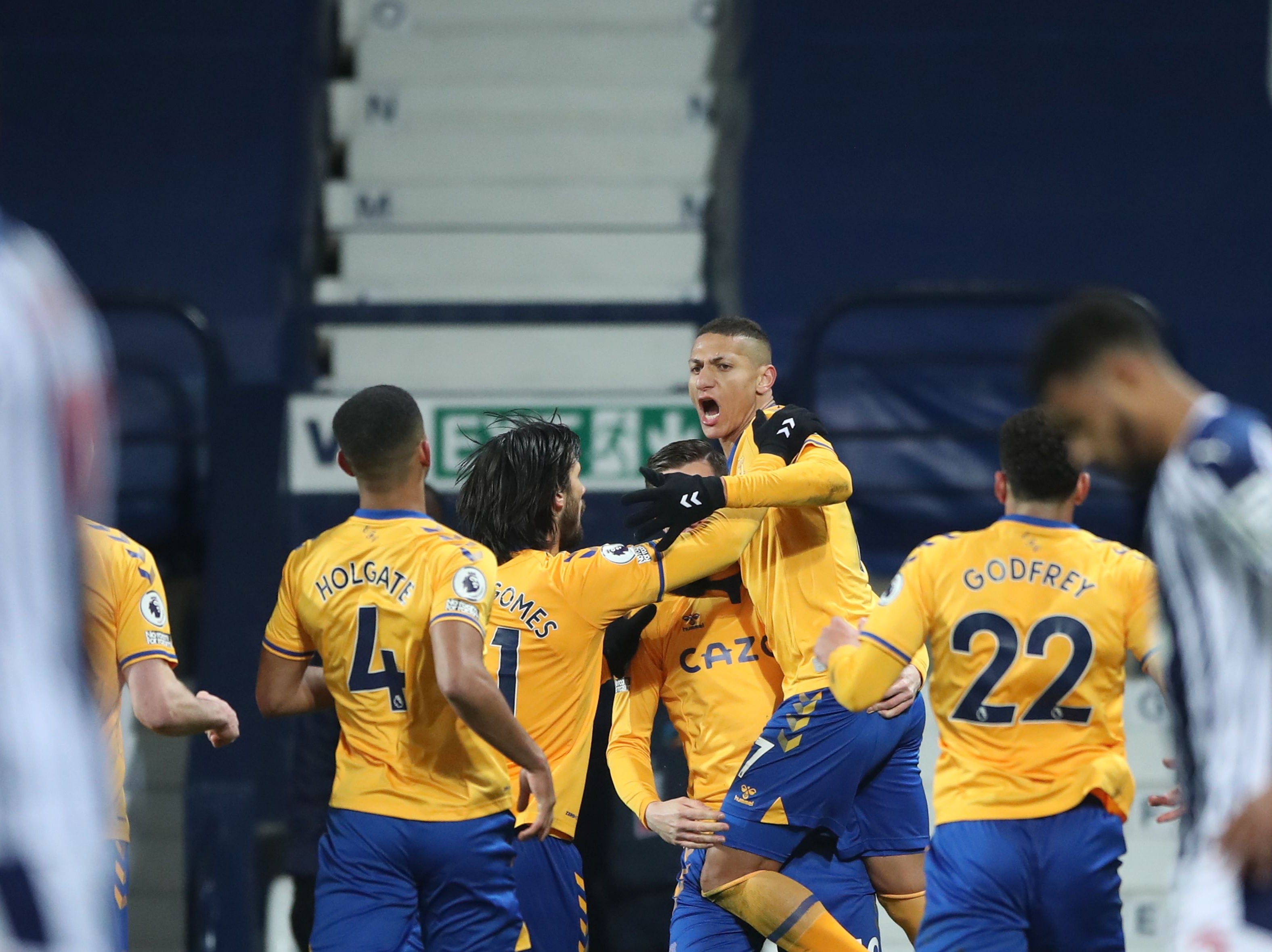 Richarlison celebrates with his team-mates after scoring the winner