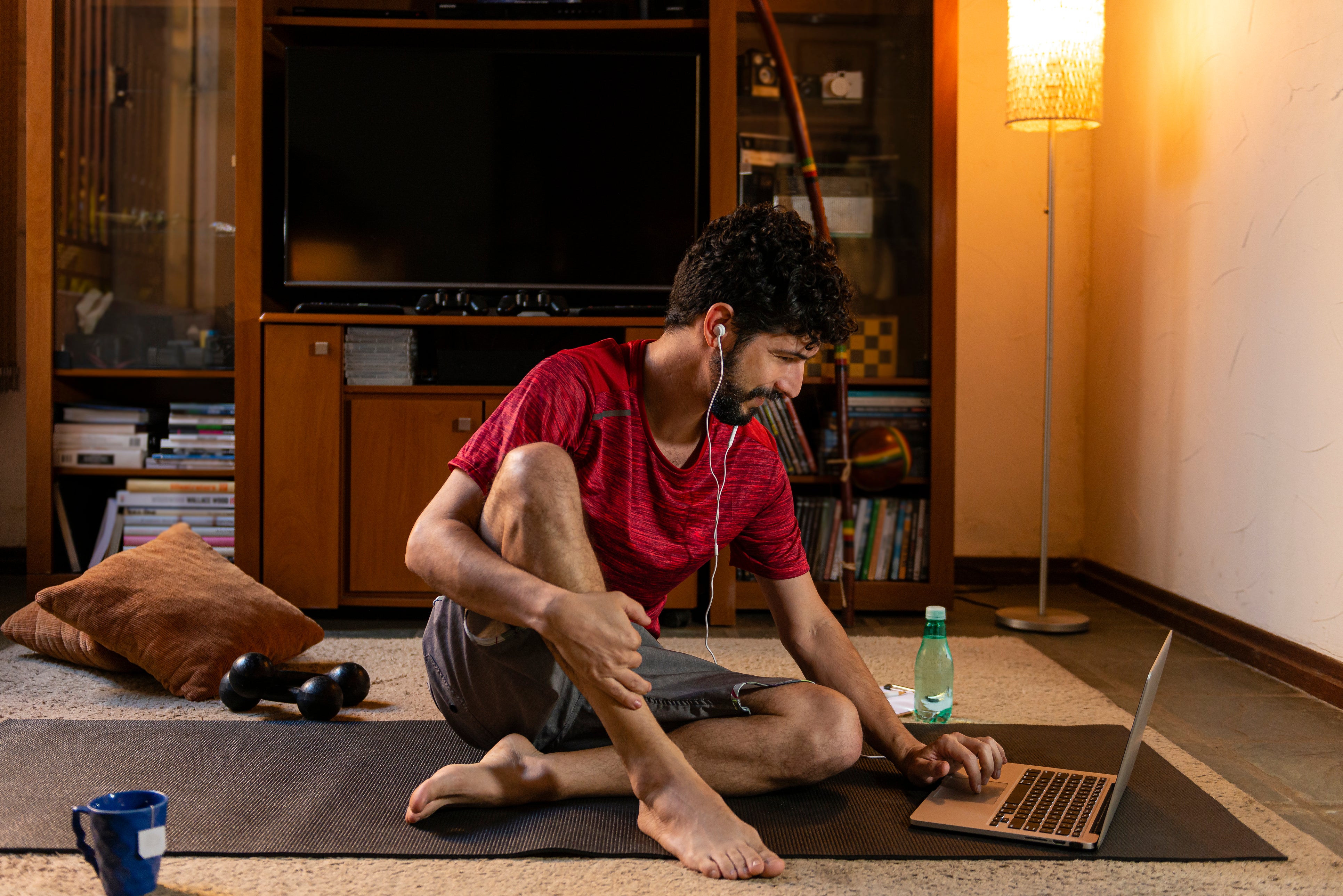 Man doing an online workout at home