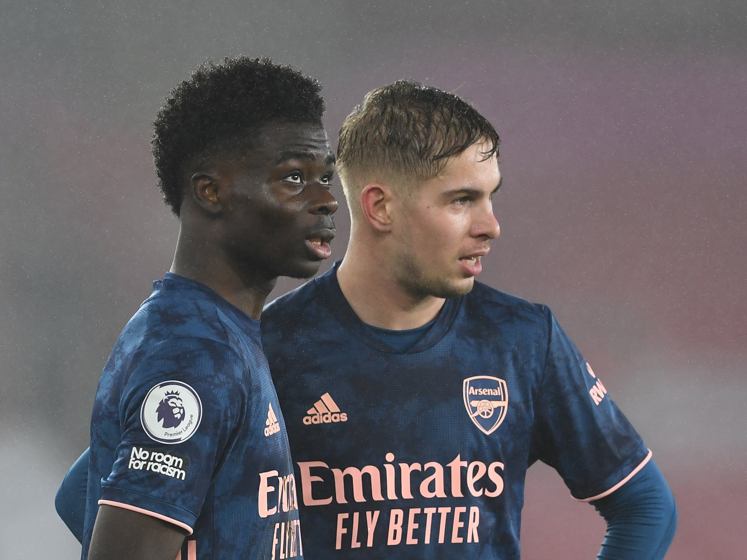 Arsenal team-mates Bukayo Saka (left) and Emile Smith Rowe