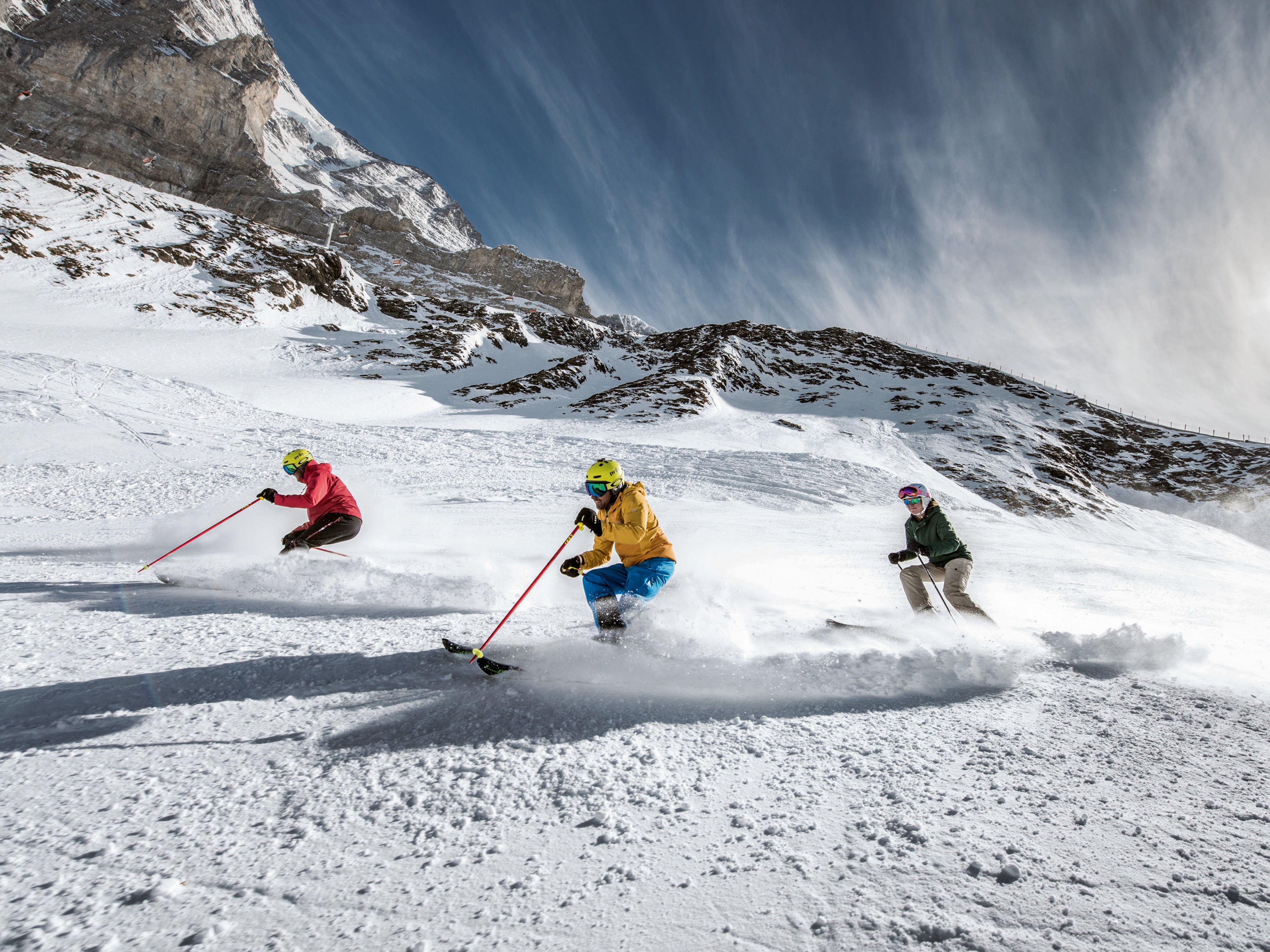 Skiers in Jungfrau. Resorts are going green to reduce their impact