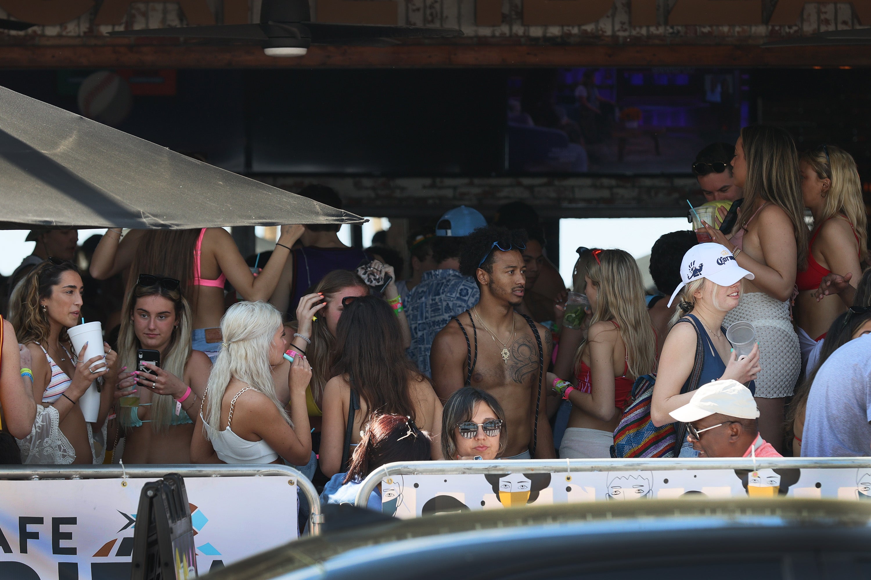 Young people without masks pack into Cafe Ibiza, a bar in Fort Lauderdale, on March 4, 2021