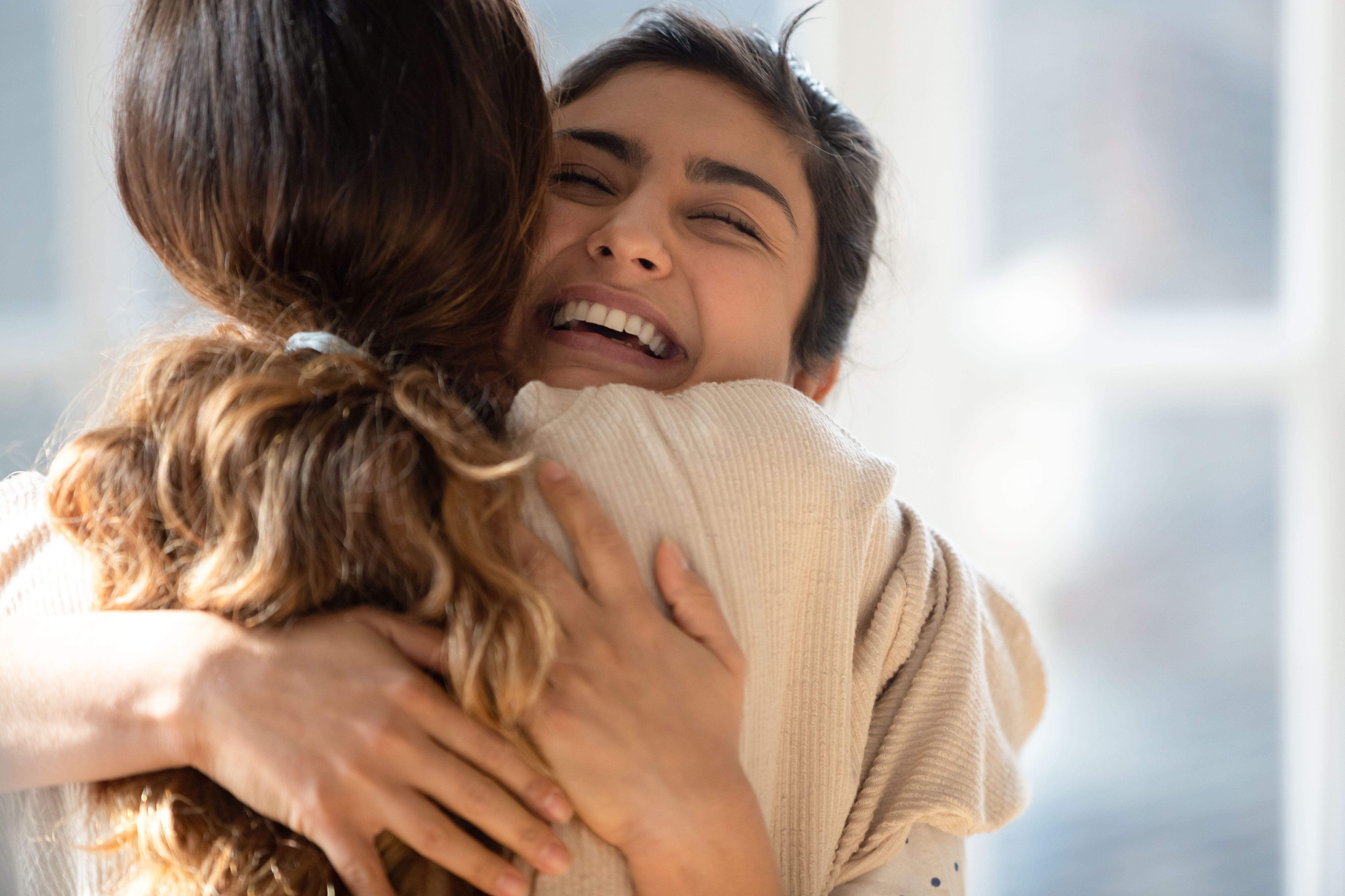 Two women hugging