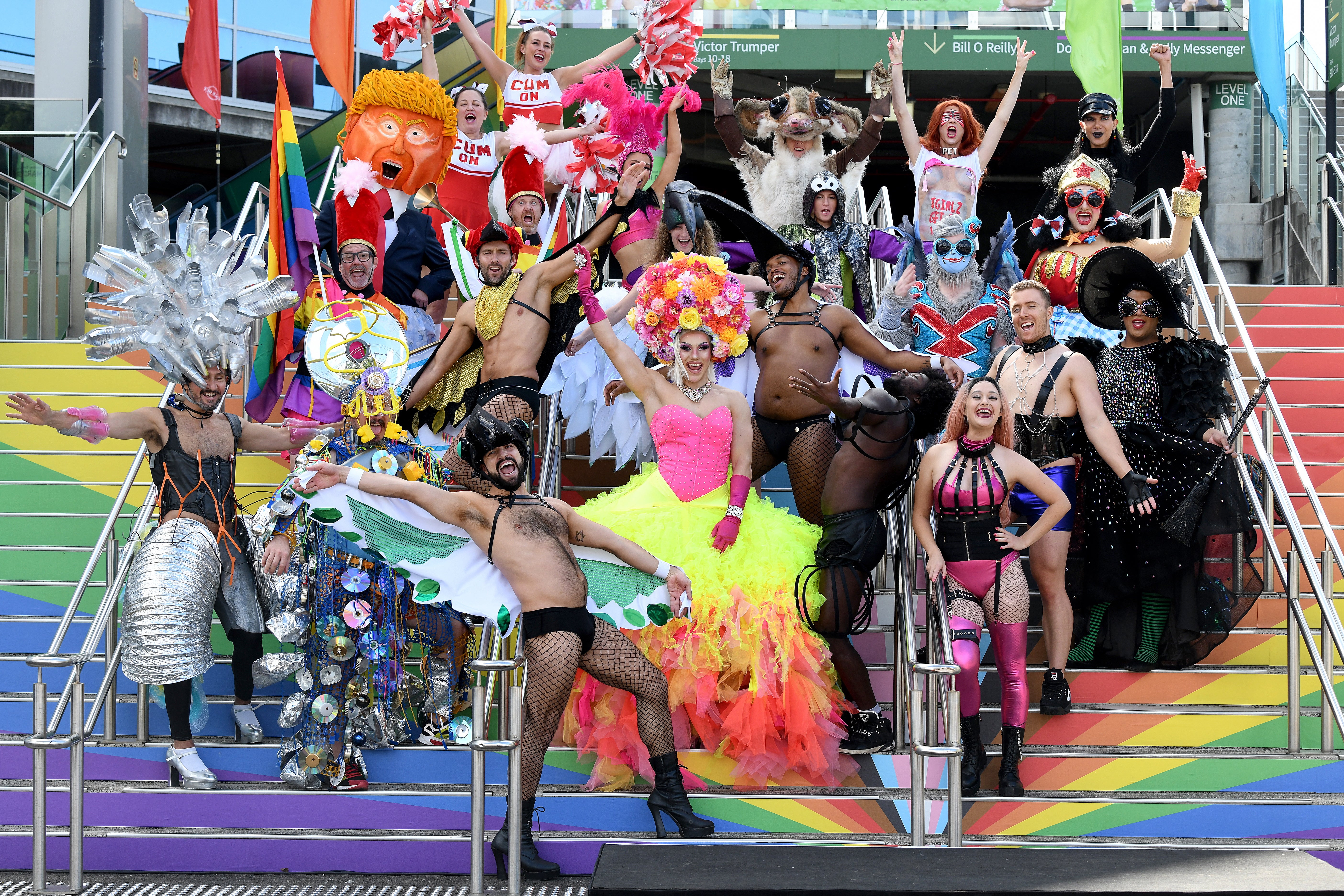 Participants of the parade pose for a photograph during a preview of the 2021 Gay and Lesbian Mardi Gras at the SCG