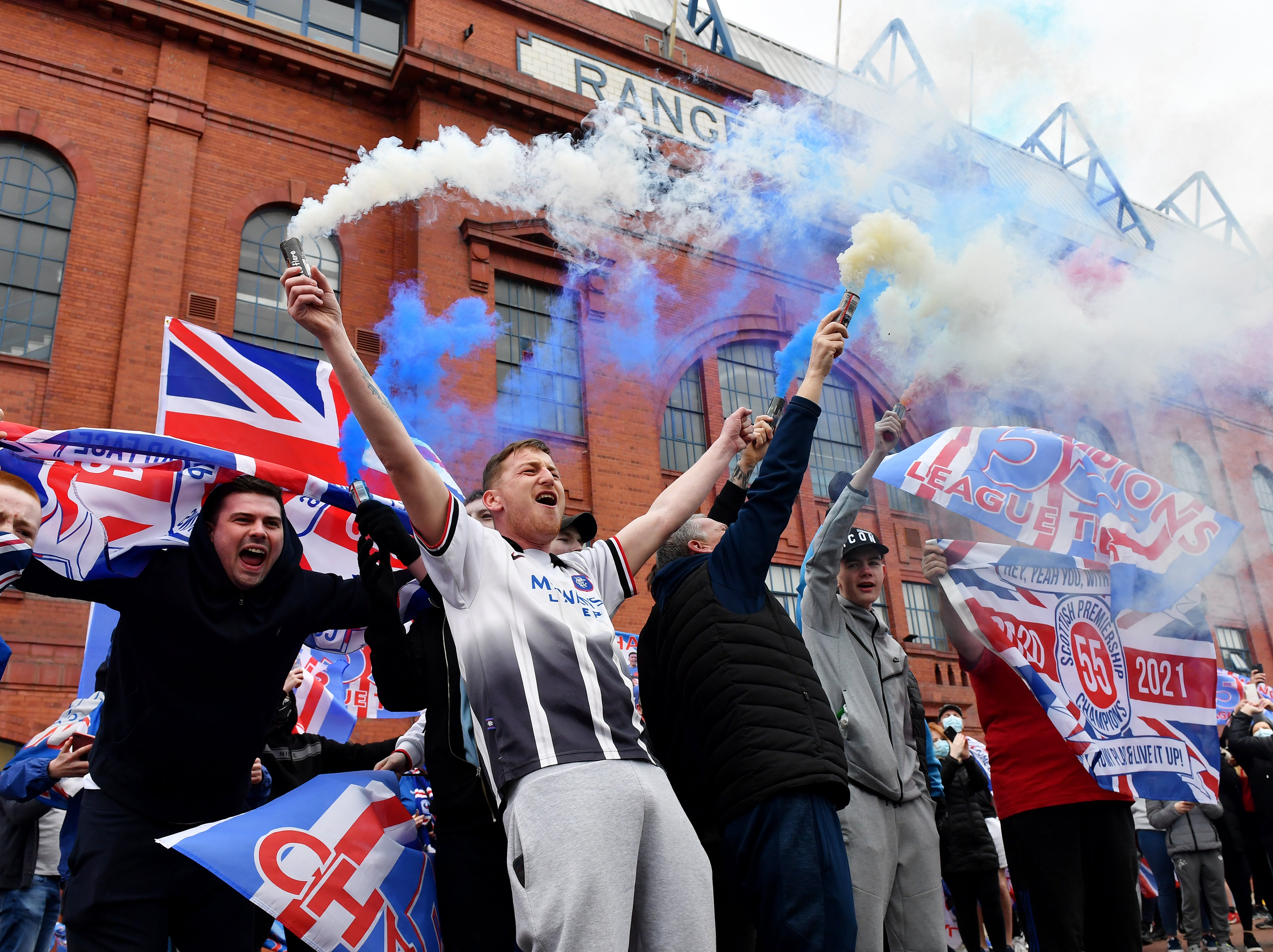 Rangers fans celebrate outside Ibrox