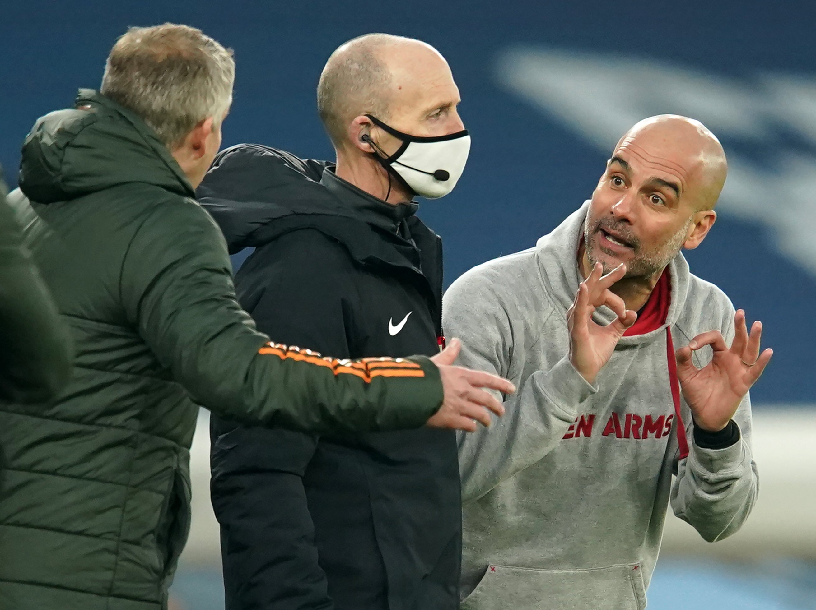 Pep Guardiola speaks to Ole Gunnar Solskjaer on the touchline