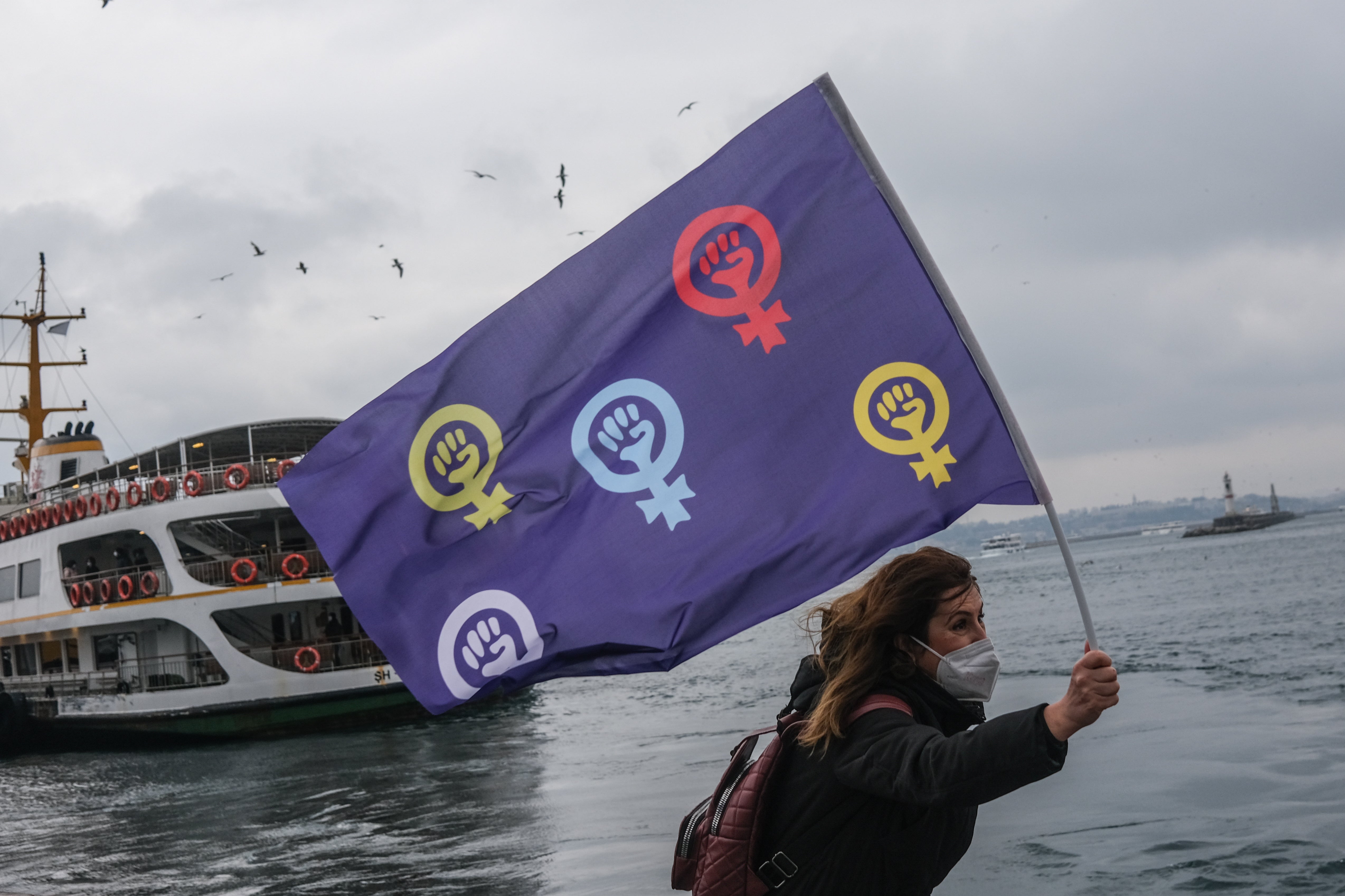 female protestor hold feminist flag and shout slogans during demonstration on the occasion of the International Day for the Elimination of Violence Against Women in Istanbul at the weekend