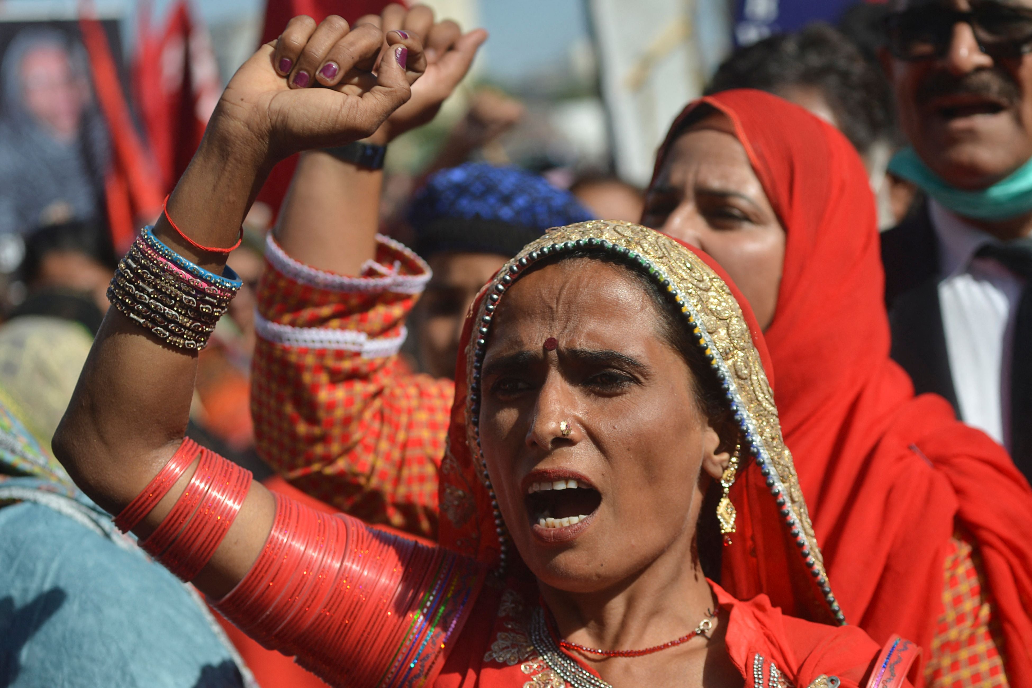 Women yell slogans during an International Women's Day rally in Karachi in Pakistan