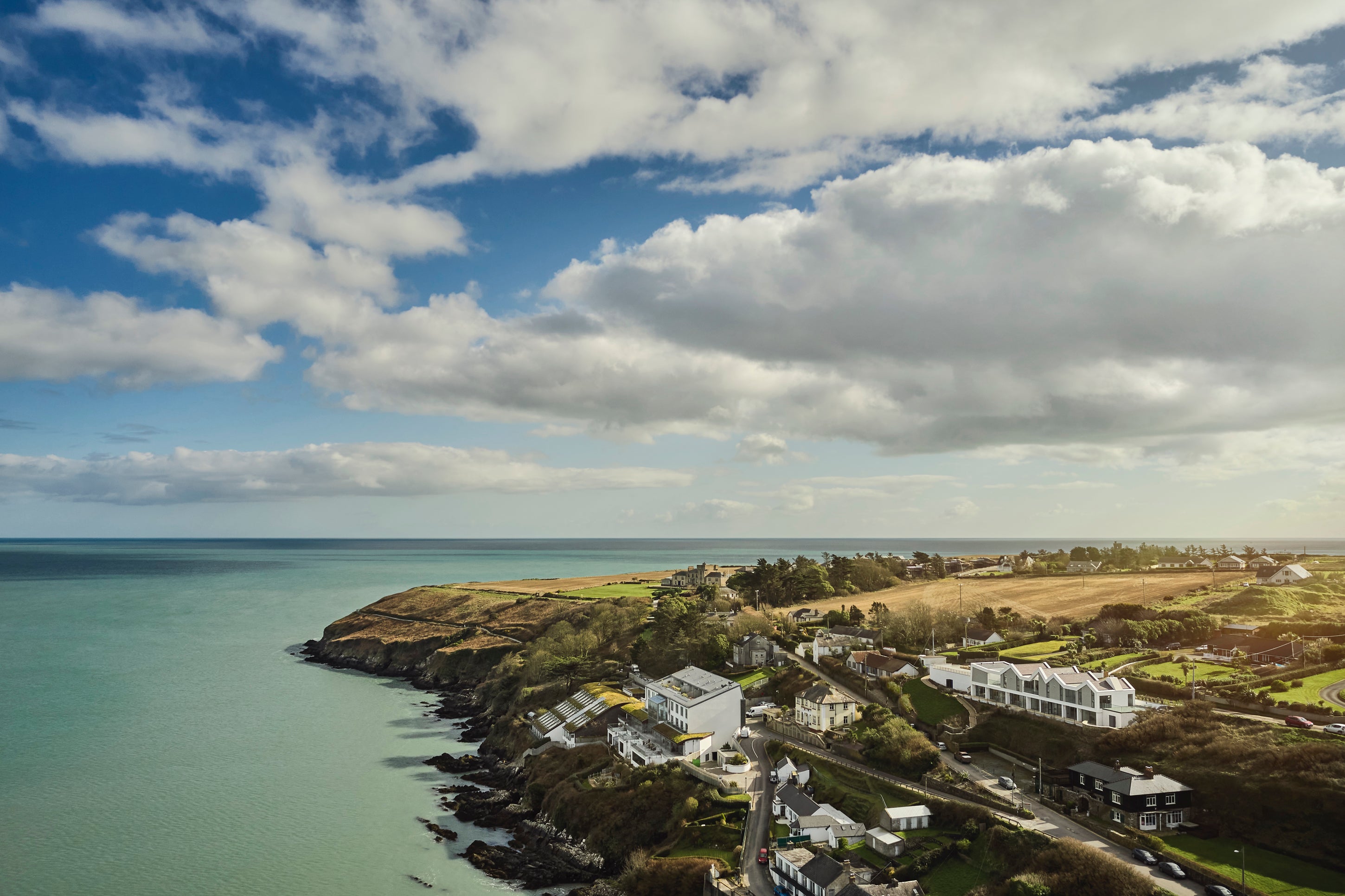 Cliff Beach House’s six bedrooms have vast glass windows framing Atlantic waves