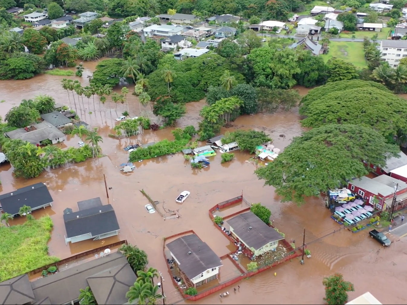 Footage taken in Haleiwa Town of Oahu on Tuesday shows homes and roads completely submerged in water