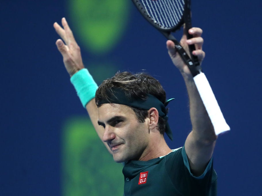 Federer celebrates defeating Dan Evans in Doha