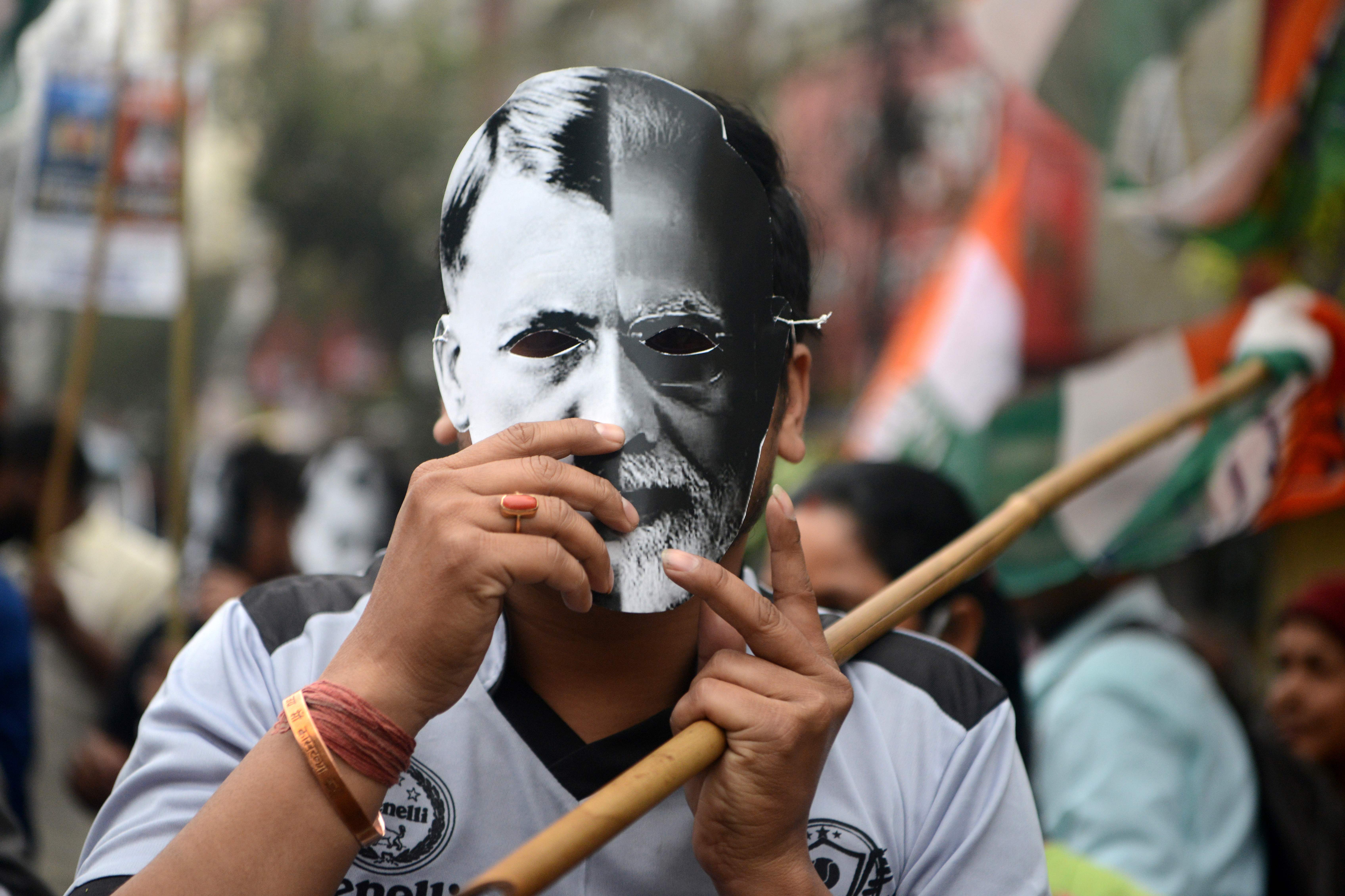 File An Indian Youth Congress activist takes part in a protest on 26 February, 2021. A Sweden-based report said India an electoral autocracy