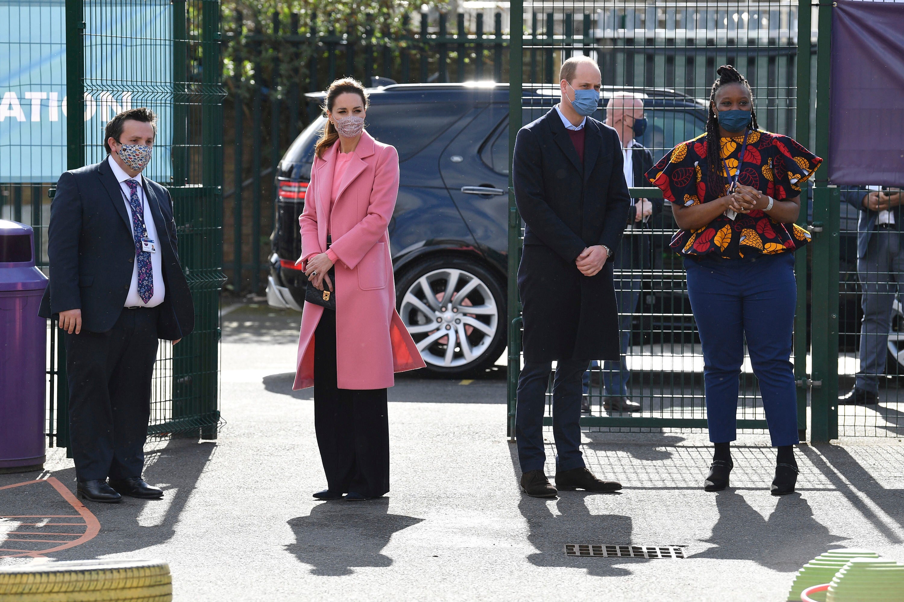 Prince William and Kate arrive at an east London school on Thursday. William told reporters that the royal family is not racist