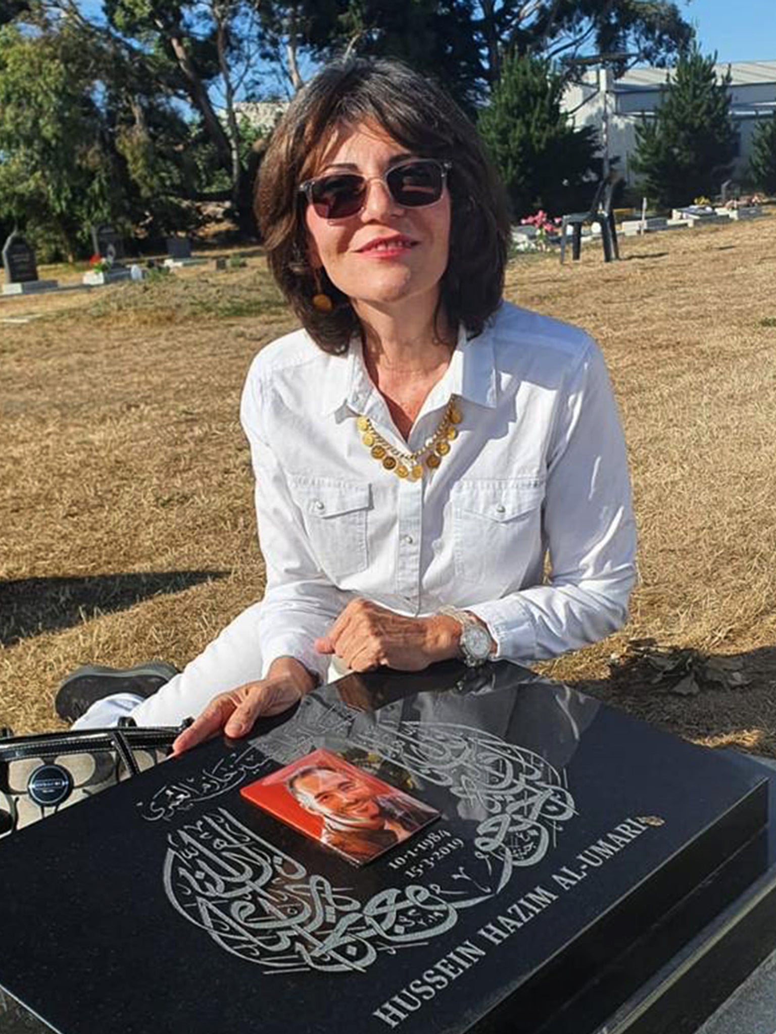 Janna Ezat at her son Hussein’s grave