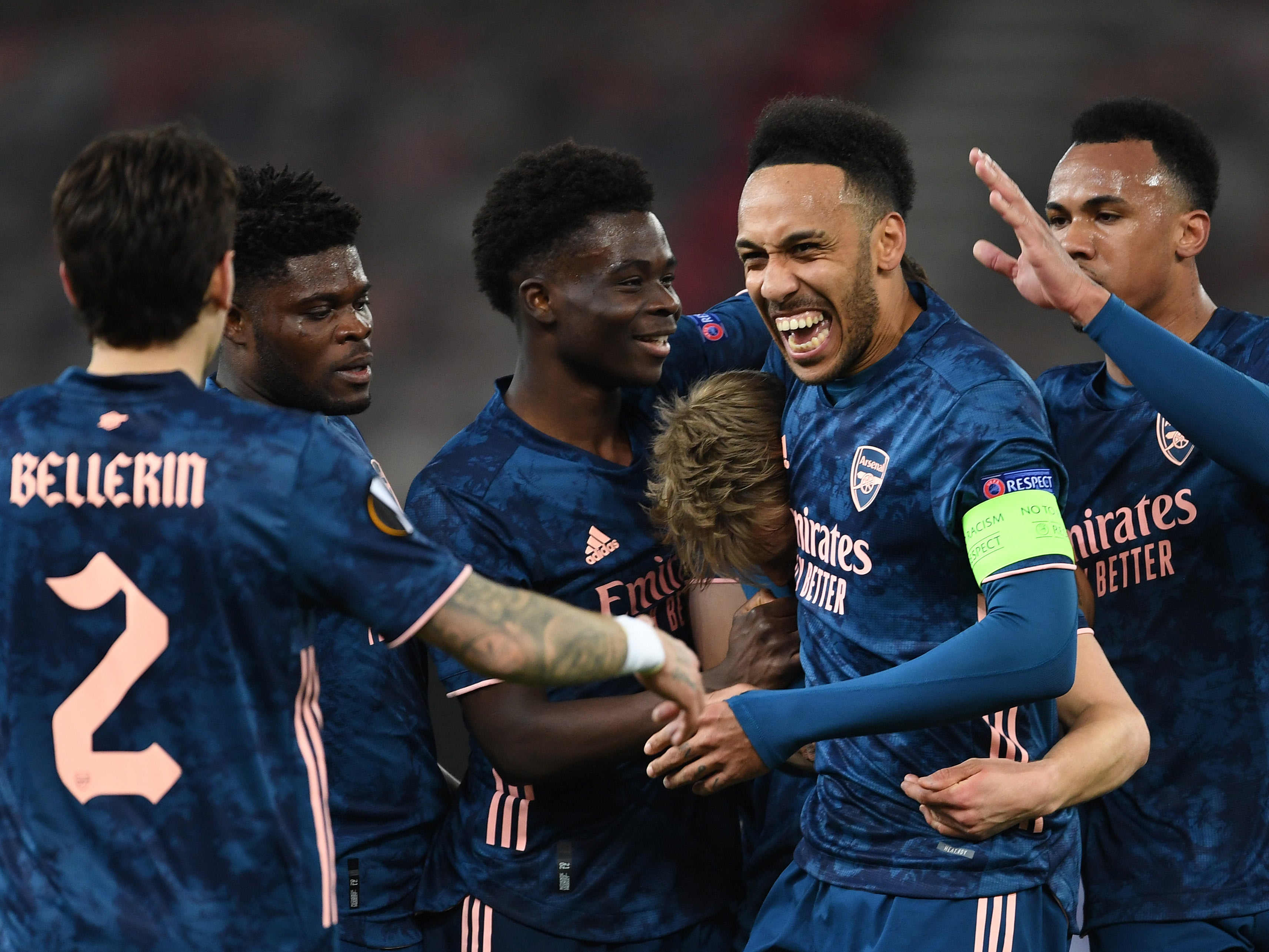 Arsenal players celebrate their victory against the Greek champions