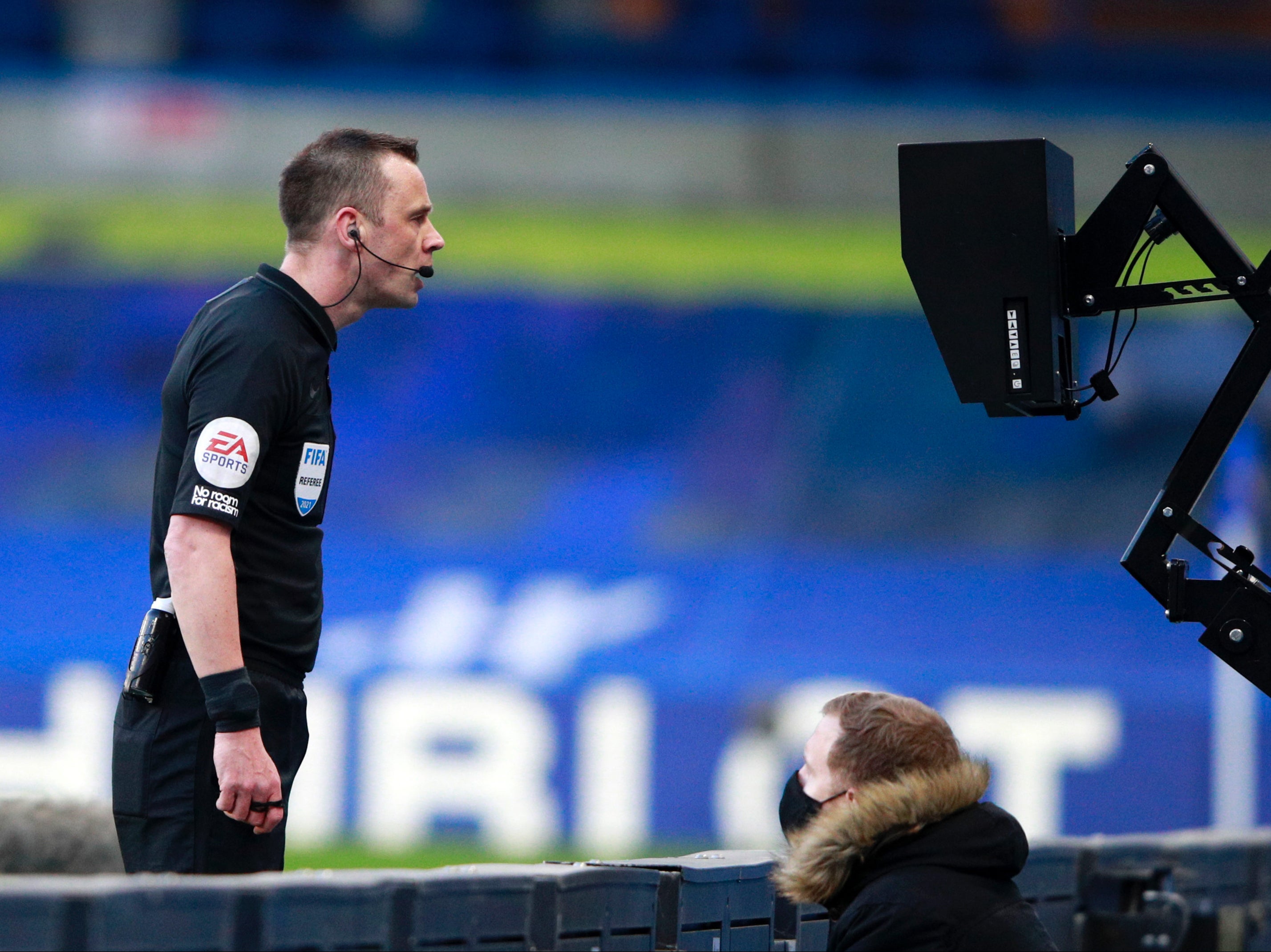 Referee Stuart Attwell checks the pitchside VAR screen