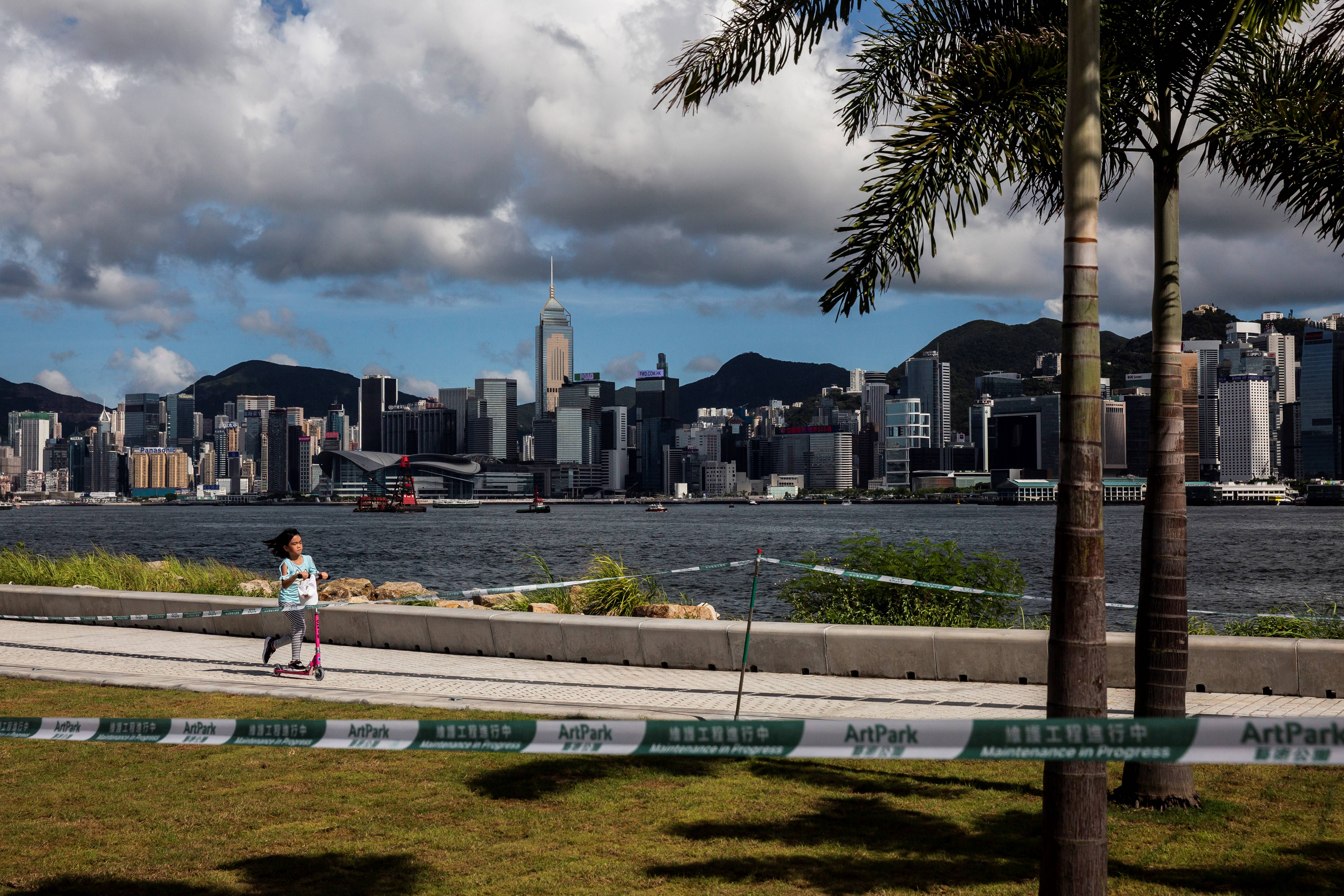 Representative: Girl rides her scooter in Hong Kong on 18 July 2020