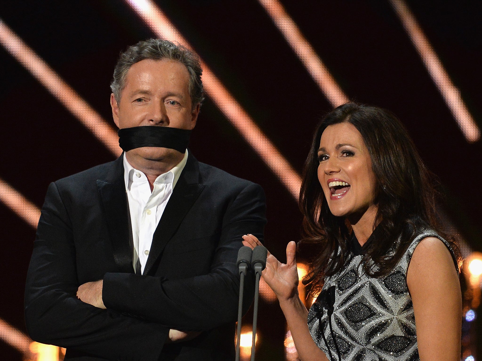 Morgan wears a comedy gag alongside Susanna Reid at the 2017 National Television Awards