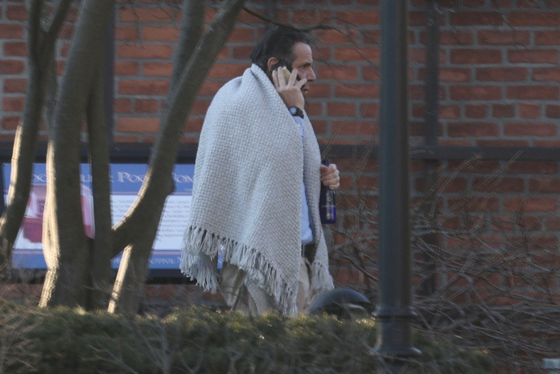 New York Governor, Andrew Cuomo, walks on the grounds of the Governor's Mansion following allegations that he had sexually harassed young women