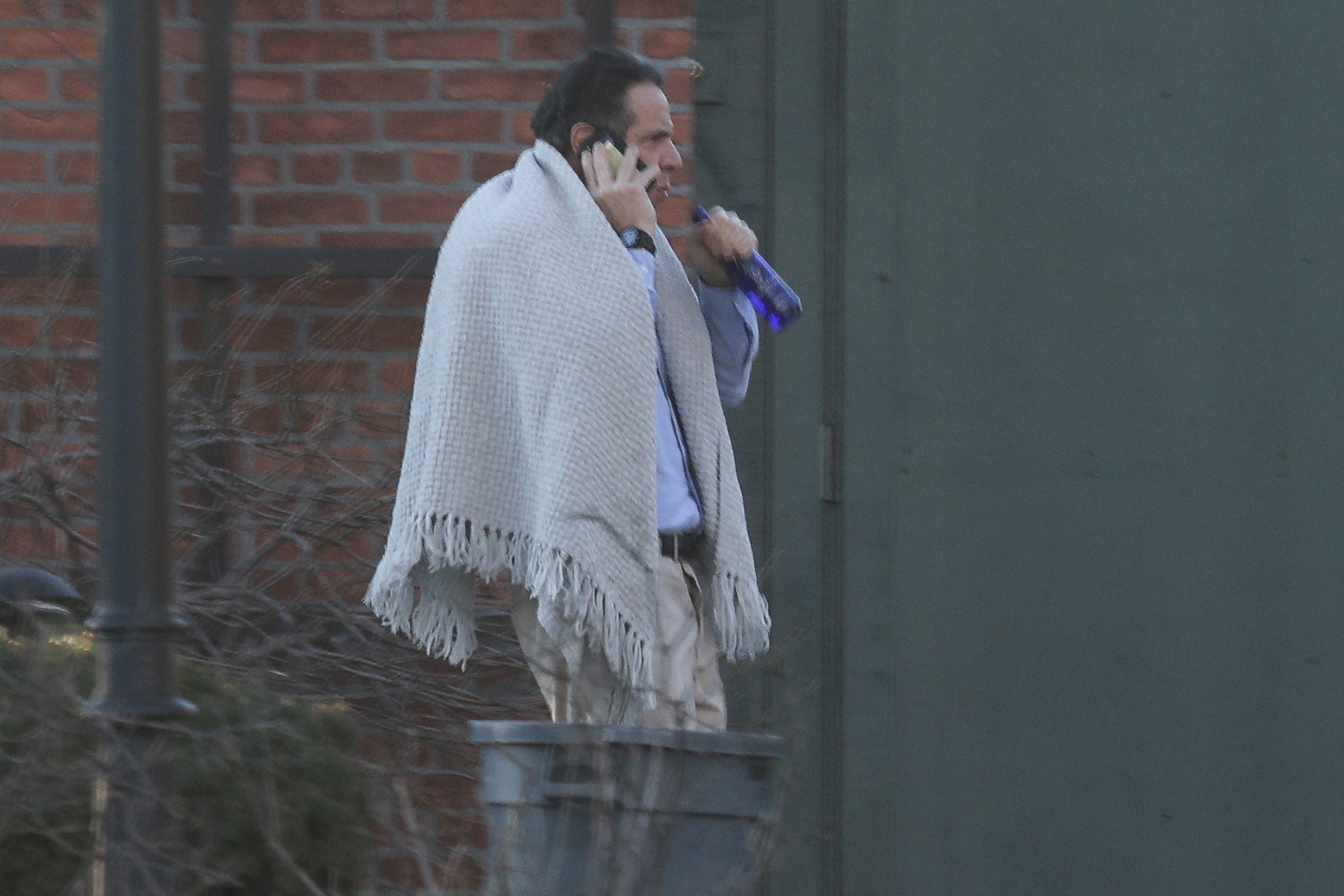 New York Governor, Andrew Cuomo, walks on the grounds of the Governor's Mansion following allegations that he had sexually harassed young women