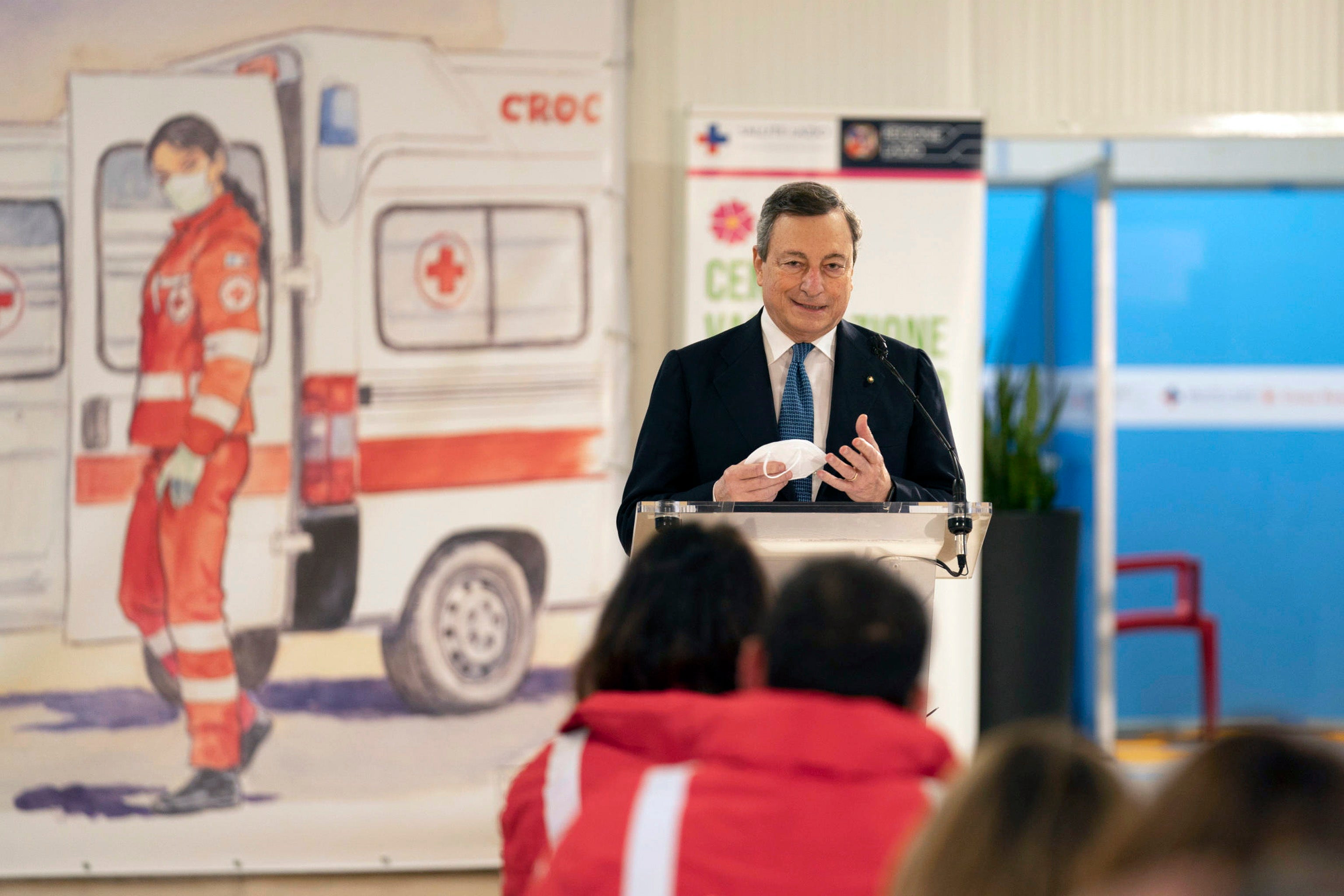 Italian prime minister Mario Draghi delivers a speech in front of medical staff at the vaccine centre of Leonardo da Vinci airport in Fiumicino, near Rome