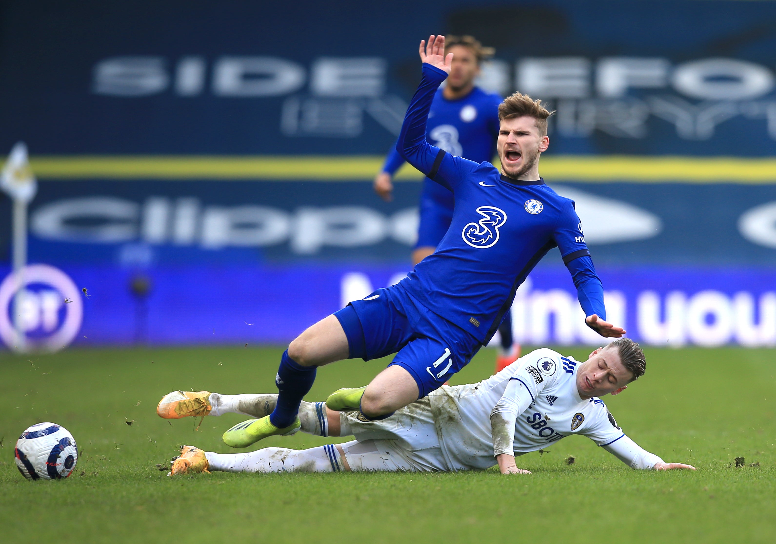 Timo Werner is challenged by Ezgjan Alioski