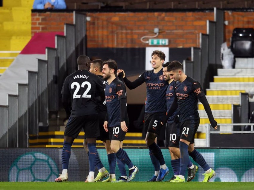 Man City celebrate John Stones’ opener