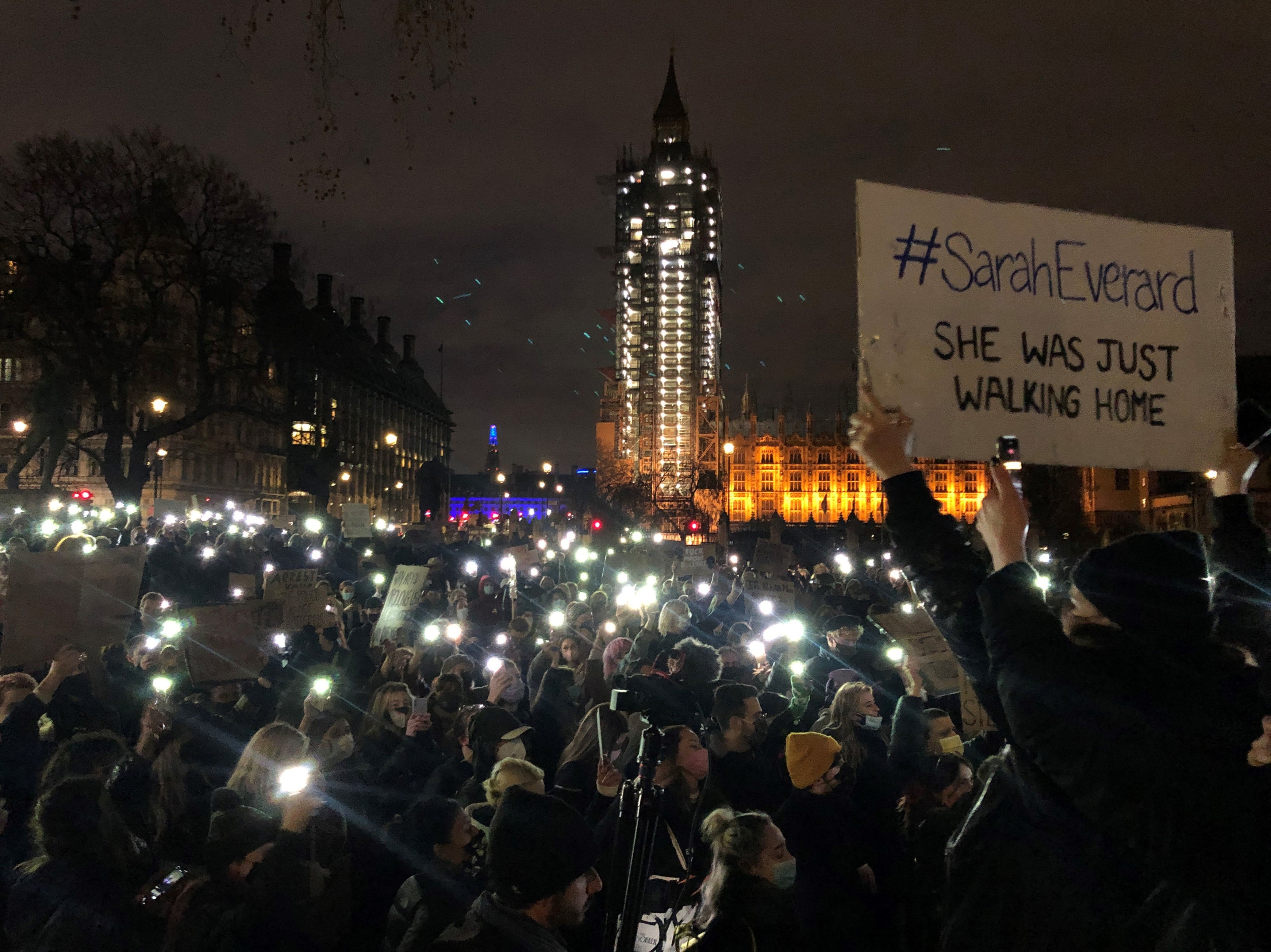 Protesters gather in Parliament Square using mobile phones as torches