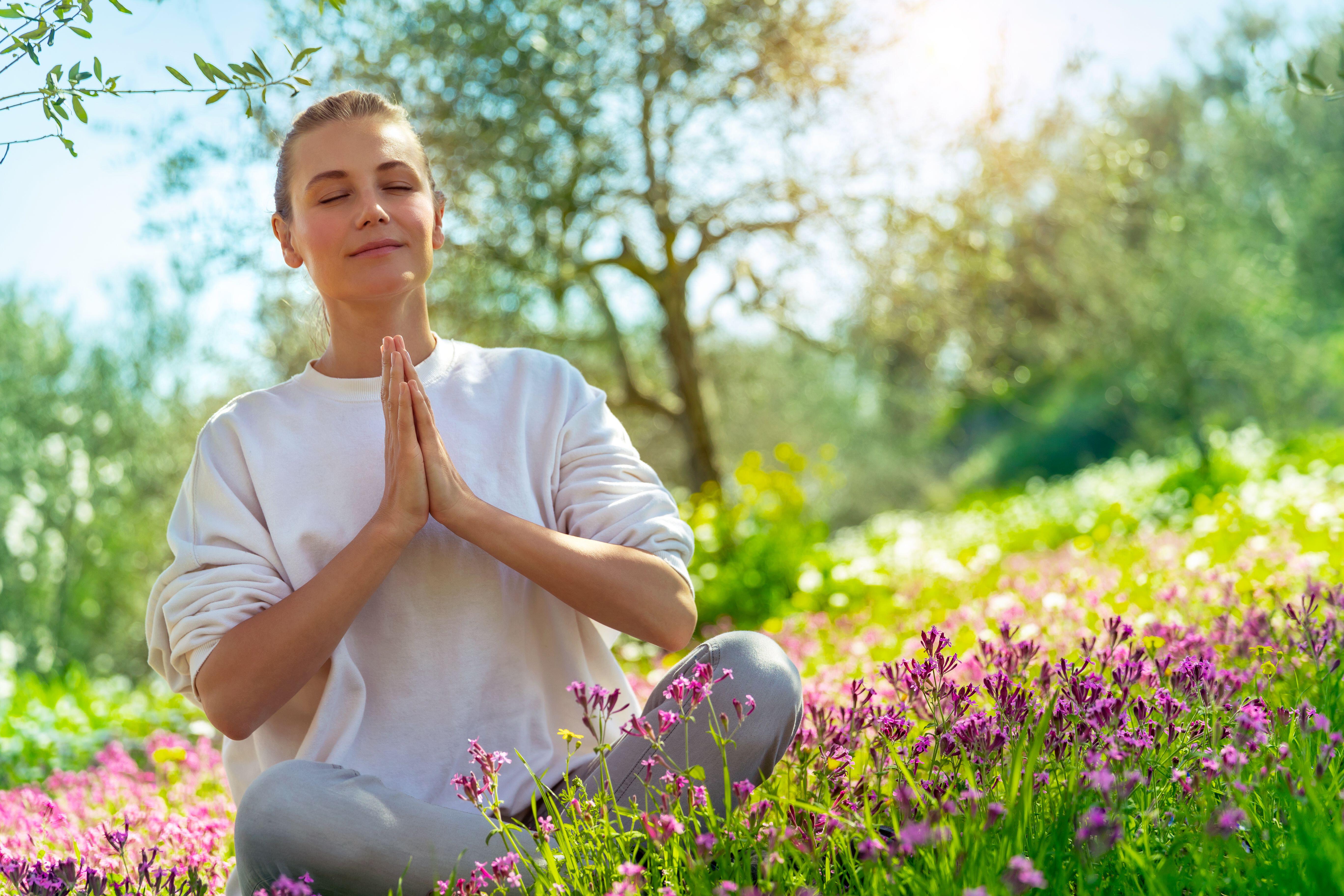 Woman doing yoga (Alamy/PA)