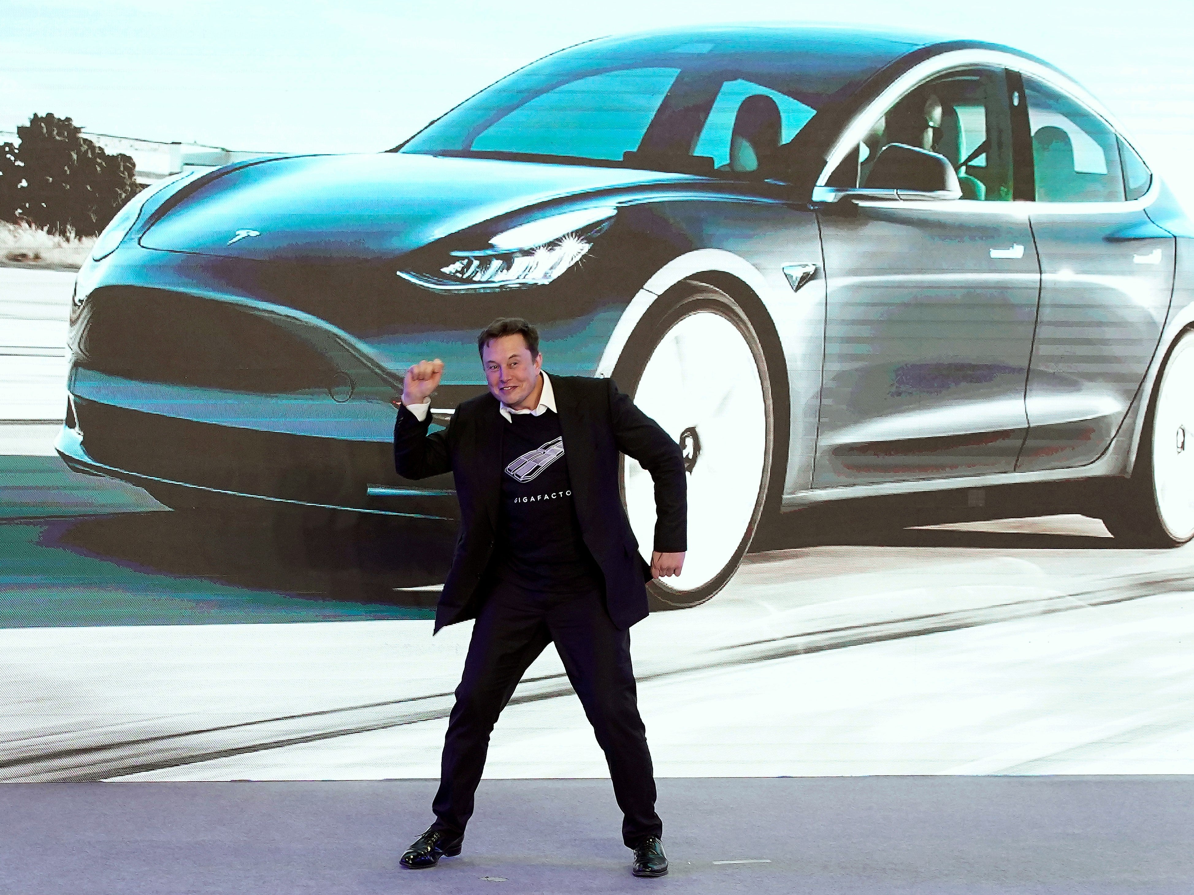 Tesla CEO Elon Musk dances onstage during a delivery event for Tesla China-made Model 3 cars in Shanghai, China 7 January, 2020