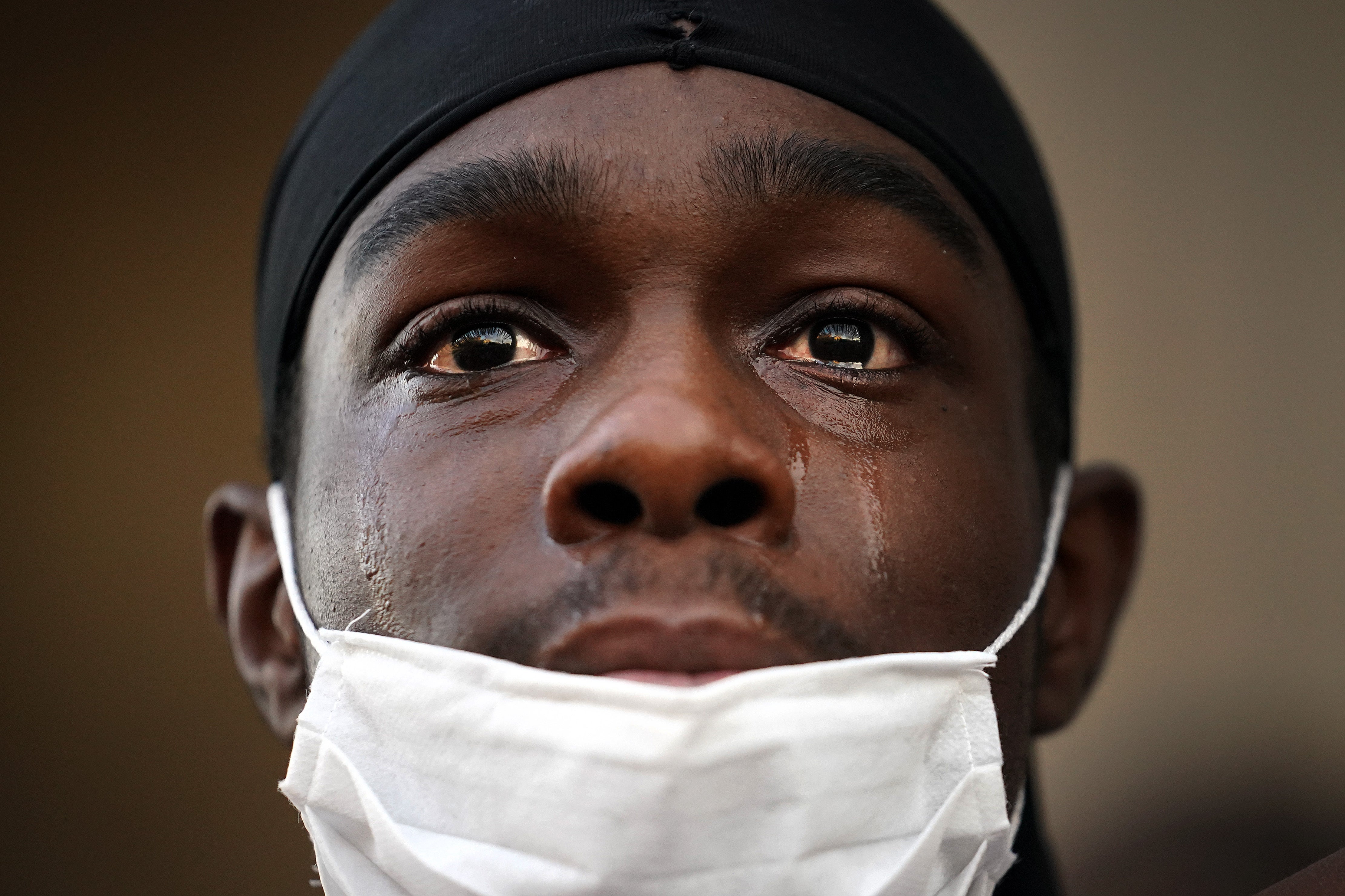 A protester is overcome with emotion as he gathers with thousands of others for a 'Black Lives Matter' solidarity demonstration outside St George's Hall on 2 June, 2020 in Liverpool, United Kingdom.