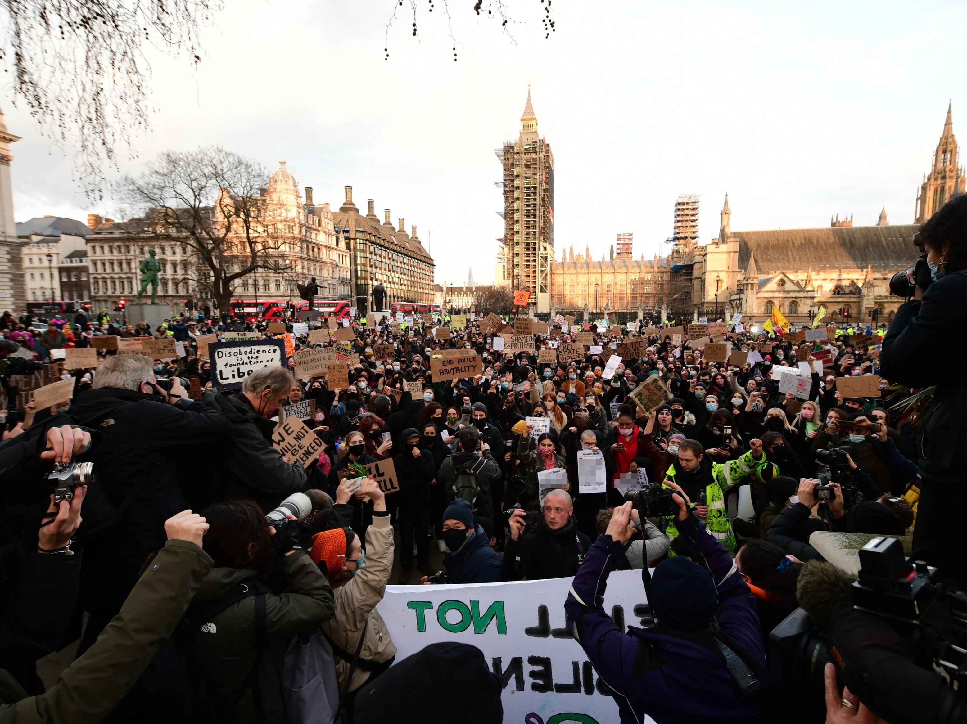 Demonstrators during a protest in Parliament Square, central London, in memory of Sarah Everard who went missing while walking home in south London