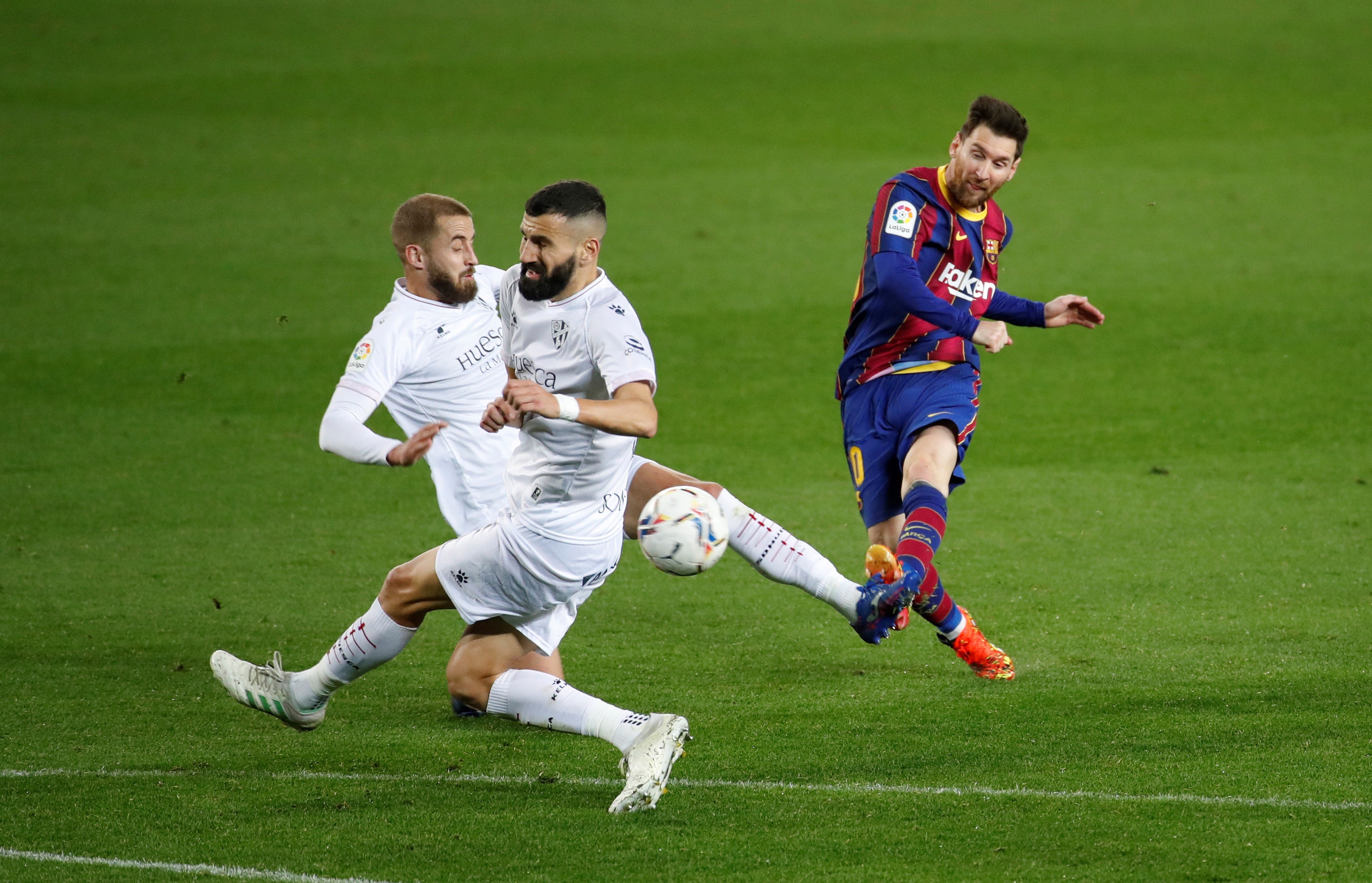 Lionel Messi fires a goal against Huesca