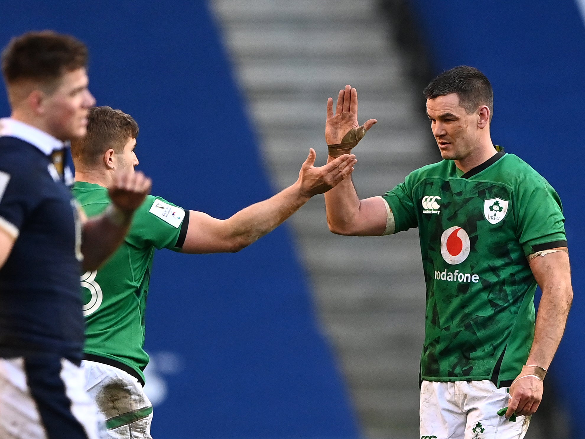 Johnny Sexton celebrates with Jordan Larmour after beating Scotland