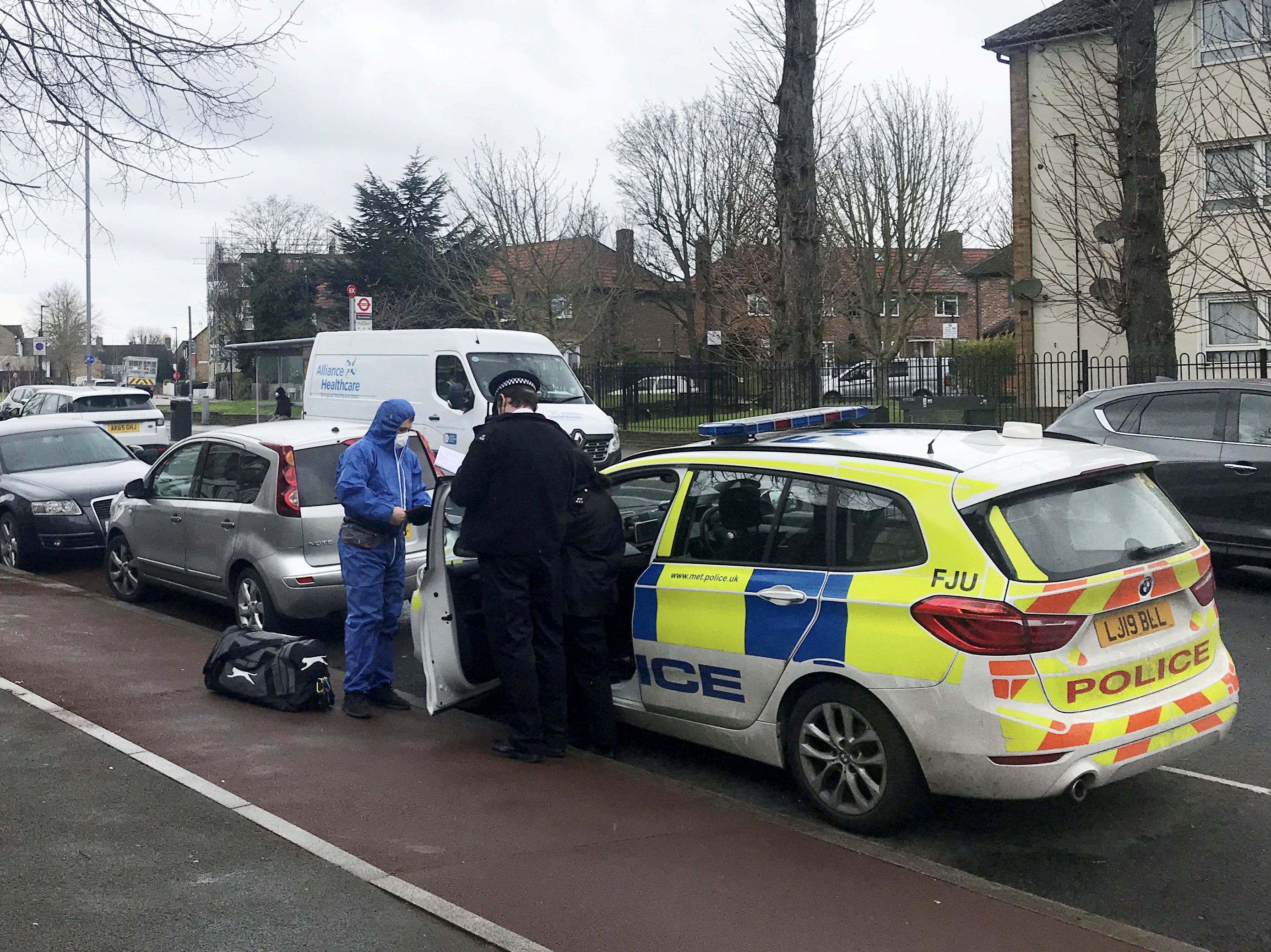 Police at the scene of a stabbing in Lea Bridge Road, Walthamstow, east London, where an 18-year-old man was killed