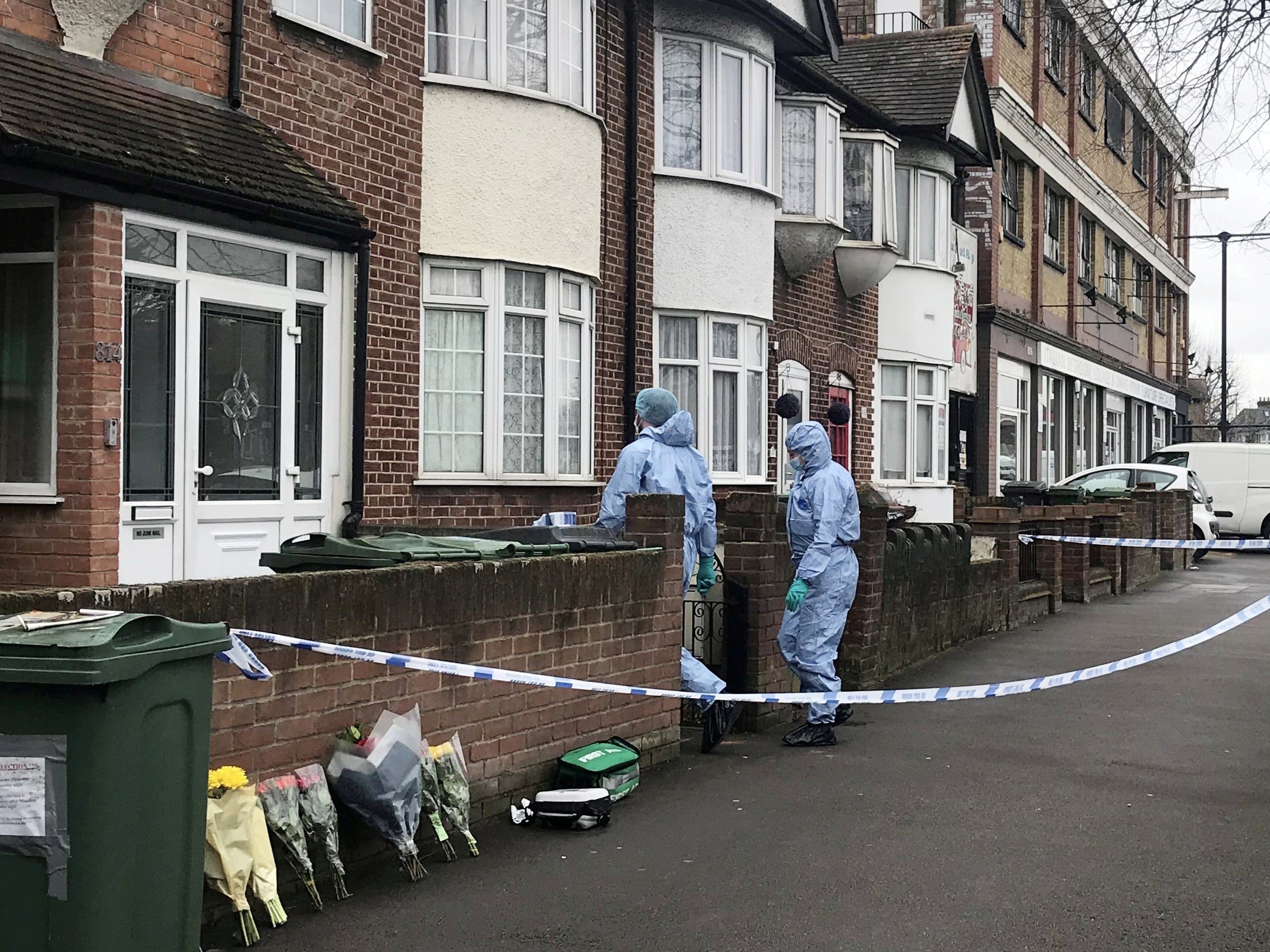 Police at the scene of a stabbing in Lea Bridge Road, Walthamstow, east London, where an 18-year-old man was stabbed to death