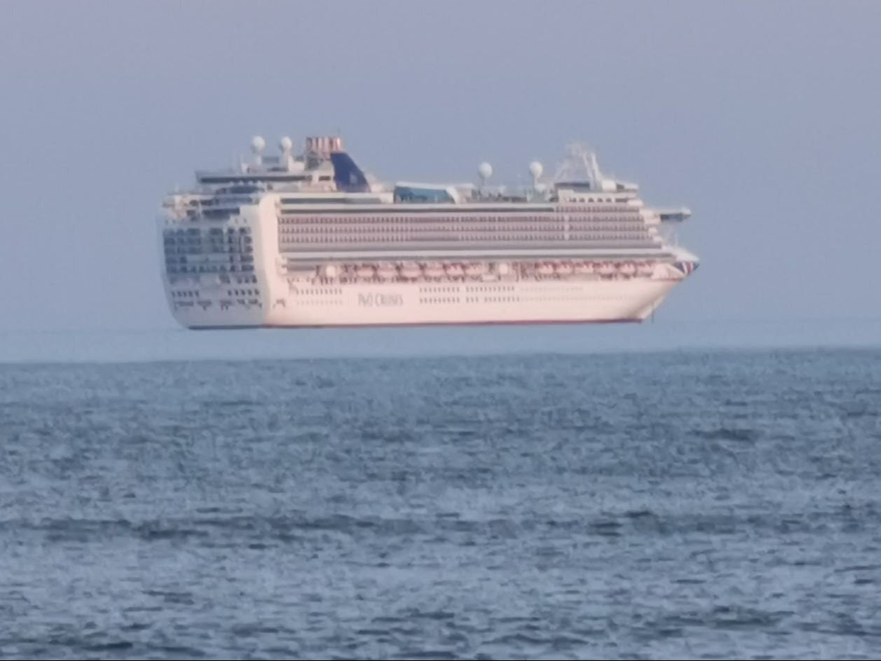 A ship appears to float in the air off Lyme Bay, Devon