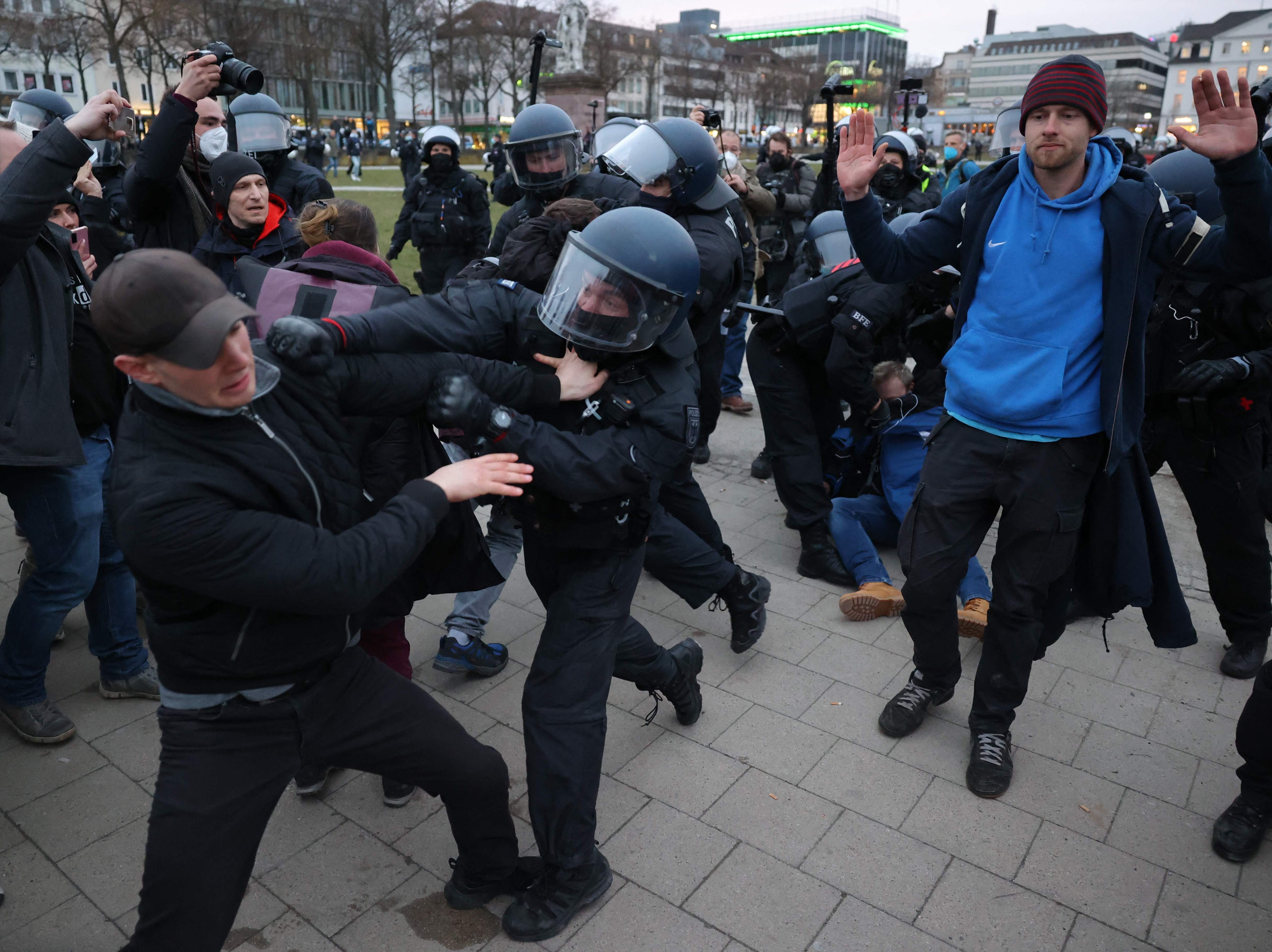 Police clear protesters from a square at the end of the demonstration in Kassel