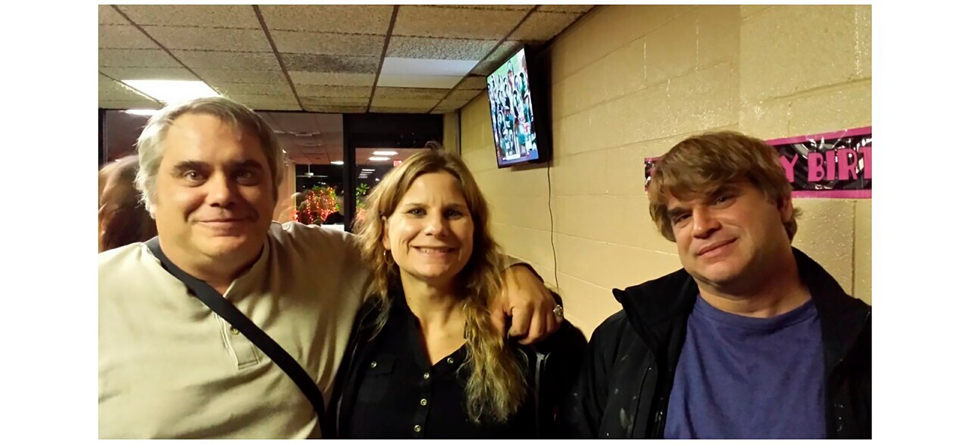 This October 2015 photo provided by John Michels, left, shows his brother Paul Andre Michels, right, posing with his sister Sarah Michels and himself, in Allen Park, Michigan. Paul Michels was among eight people killed March 16, 2021, in shootings at three Georgia massage parlors in the Atlanta area.