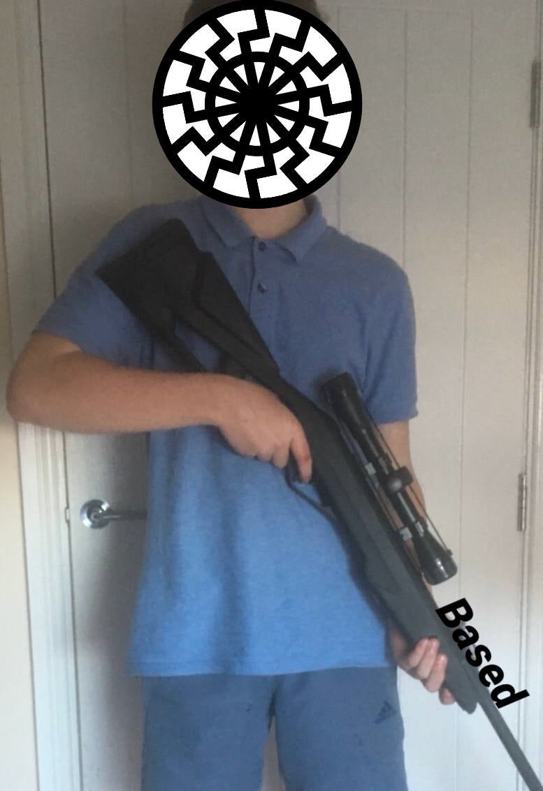 A British member of the National Partisan Movement poses with an airsoft rifle