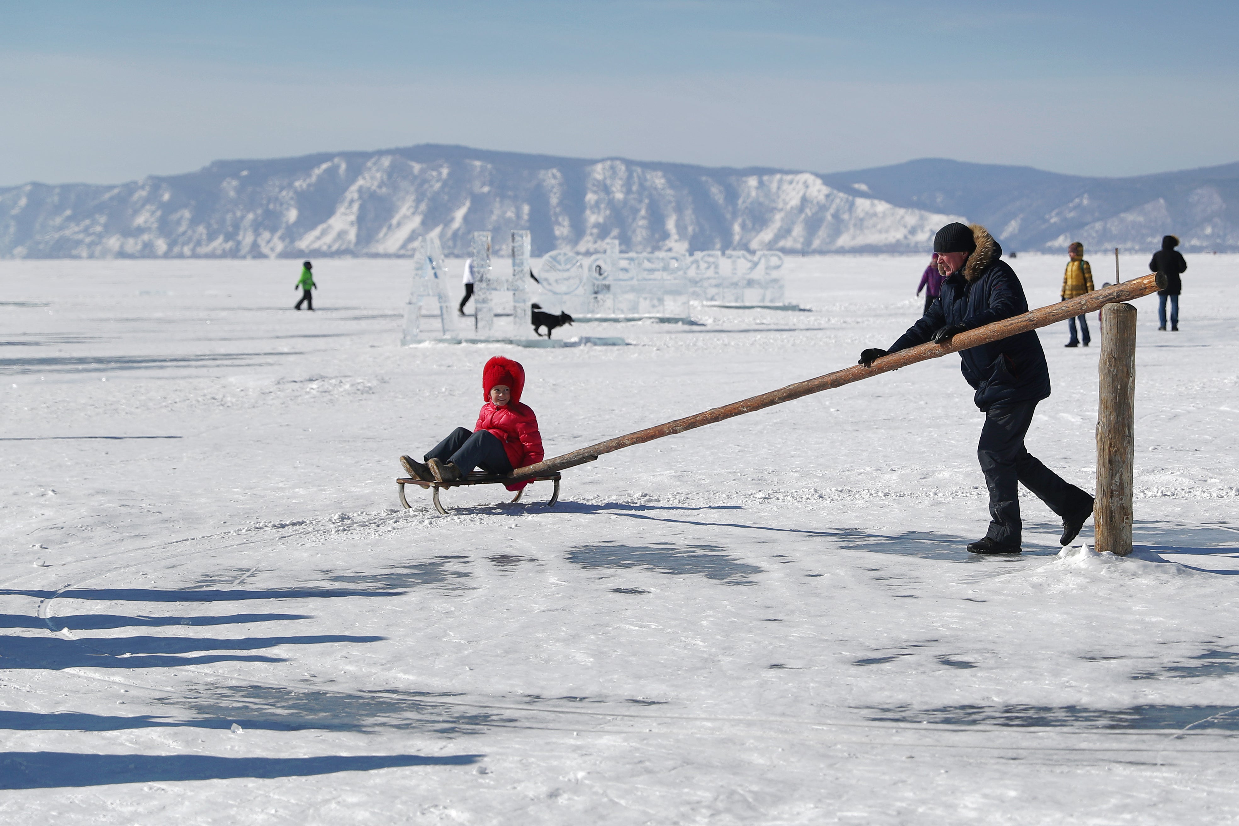 The most in-demand photos involve the clear ice, so some guides carry brushes to sweep away the snow