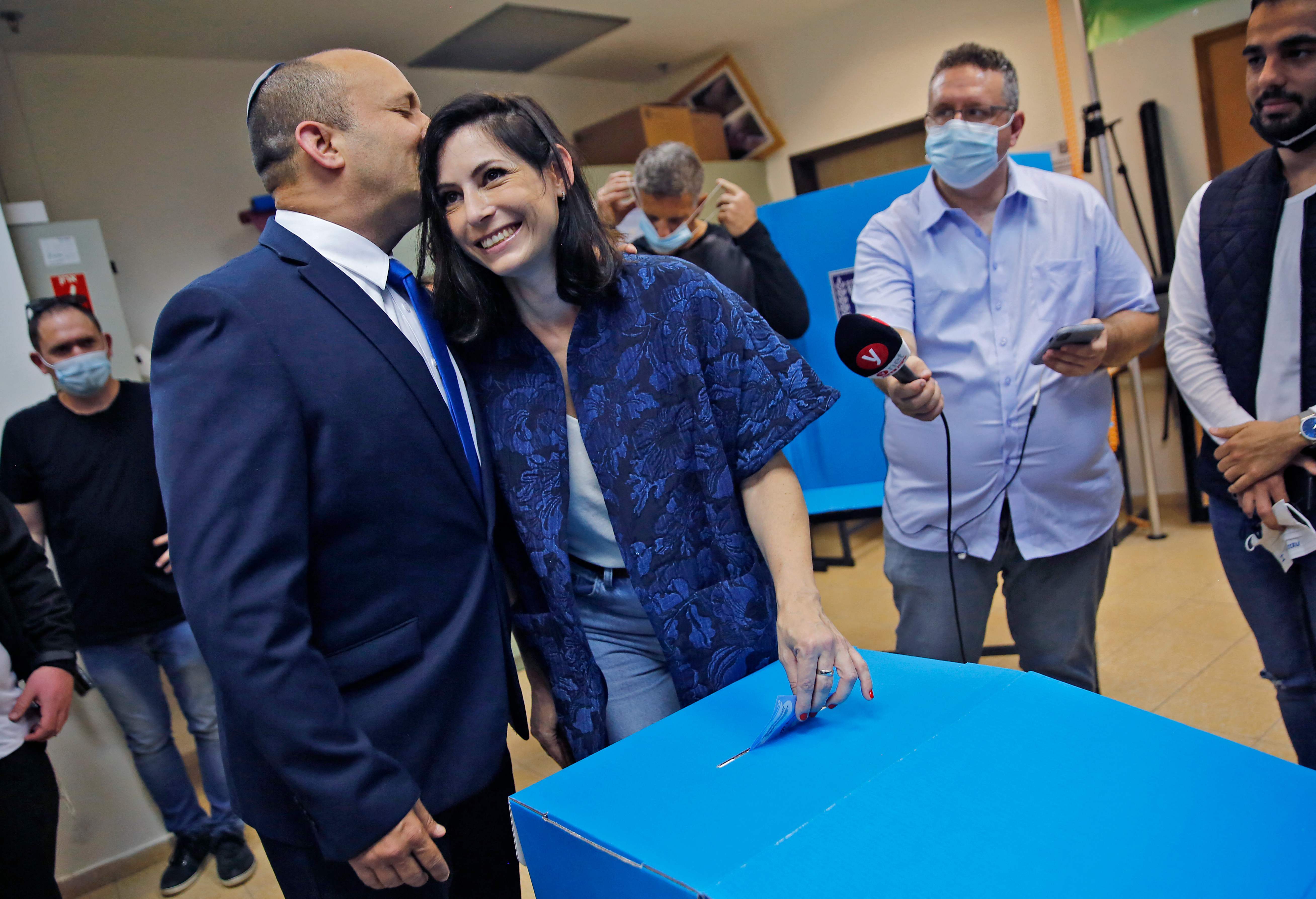 Naftali Bennett and his wife Gilat at a polling station in Raanana.