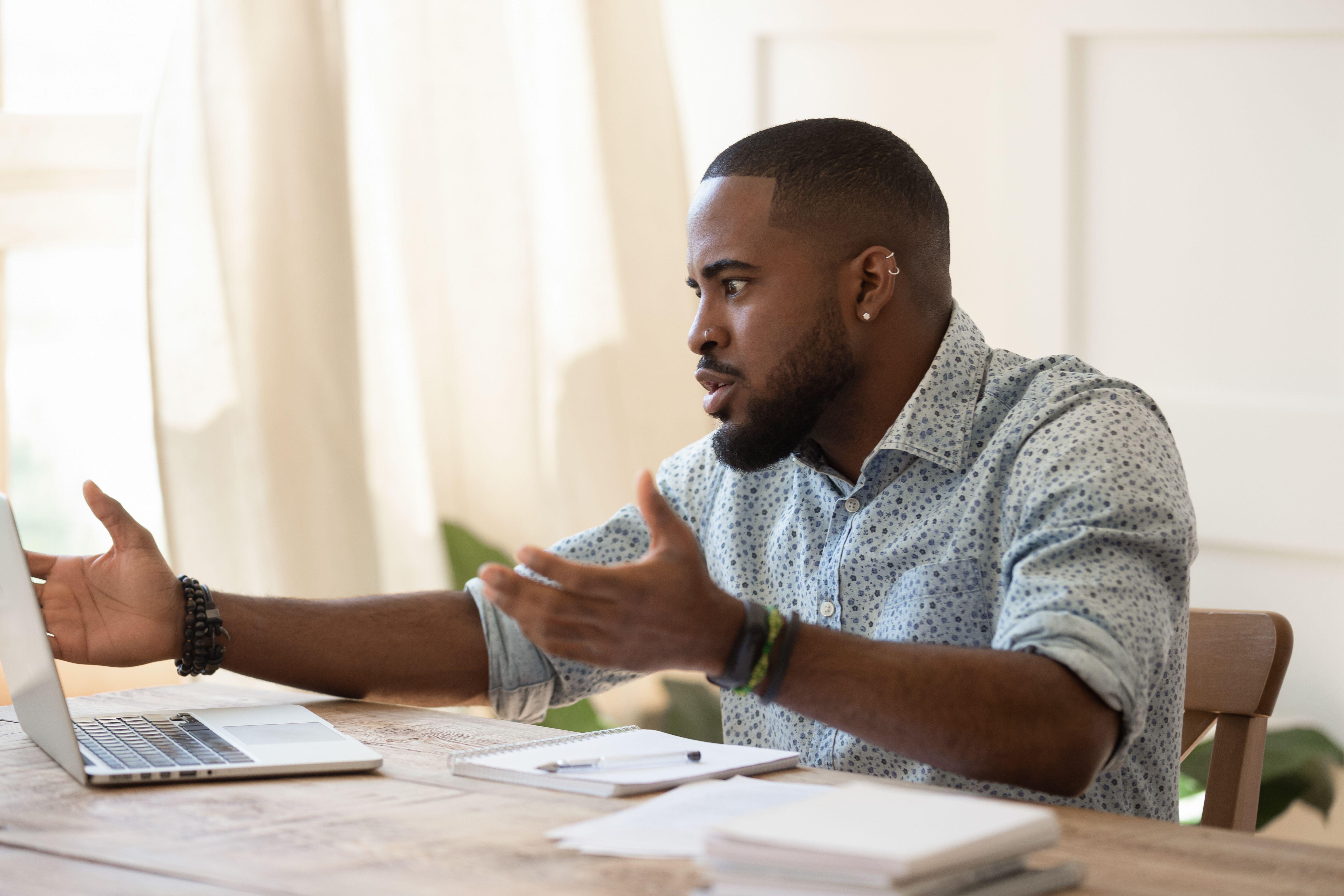 man looking annoyed while on a video call