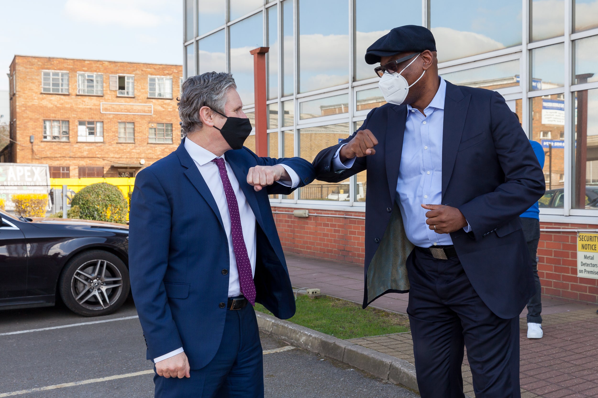 Keir Starmer greets a roundtable discussion attendee in Brent