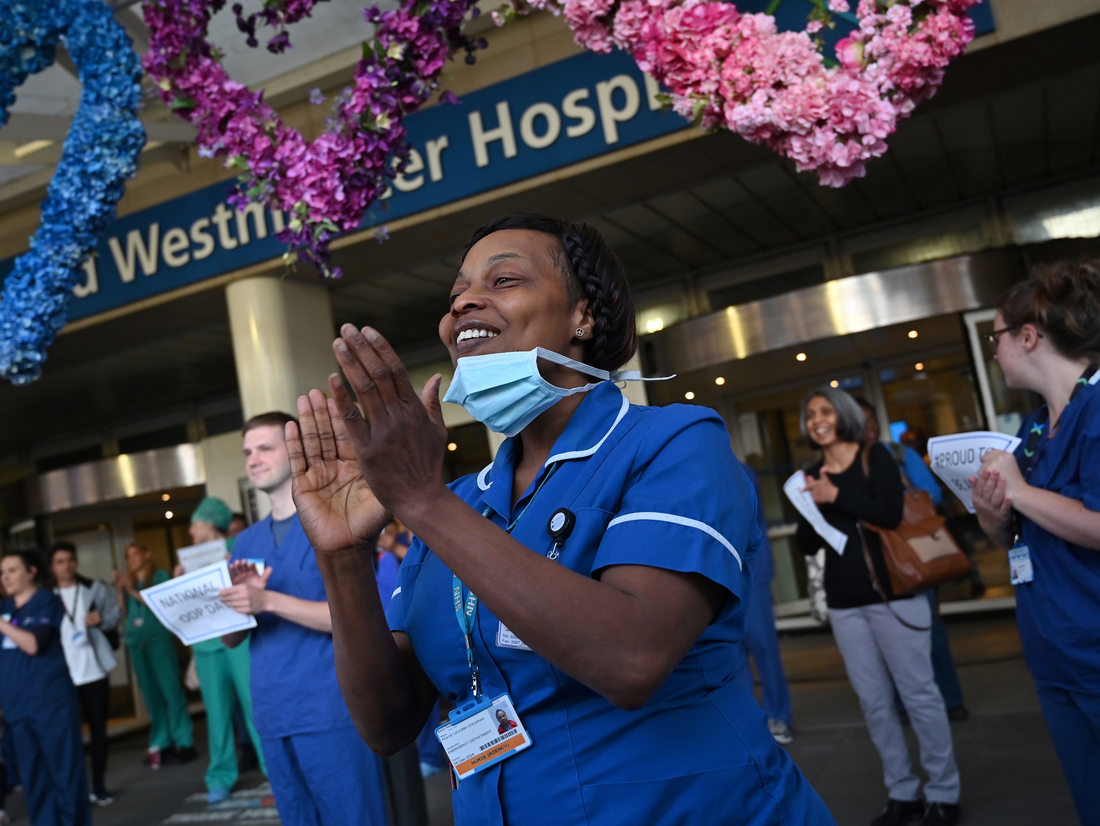 NHS workers participate in a national ‘clap for carers’ in May 2020