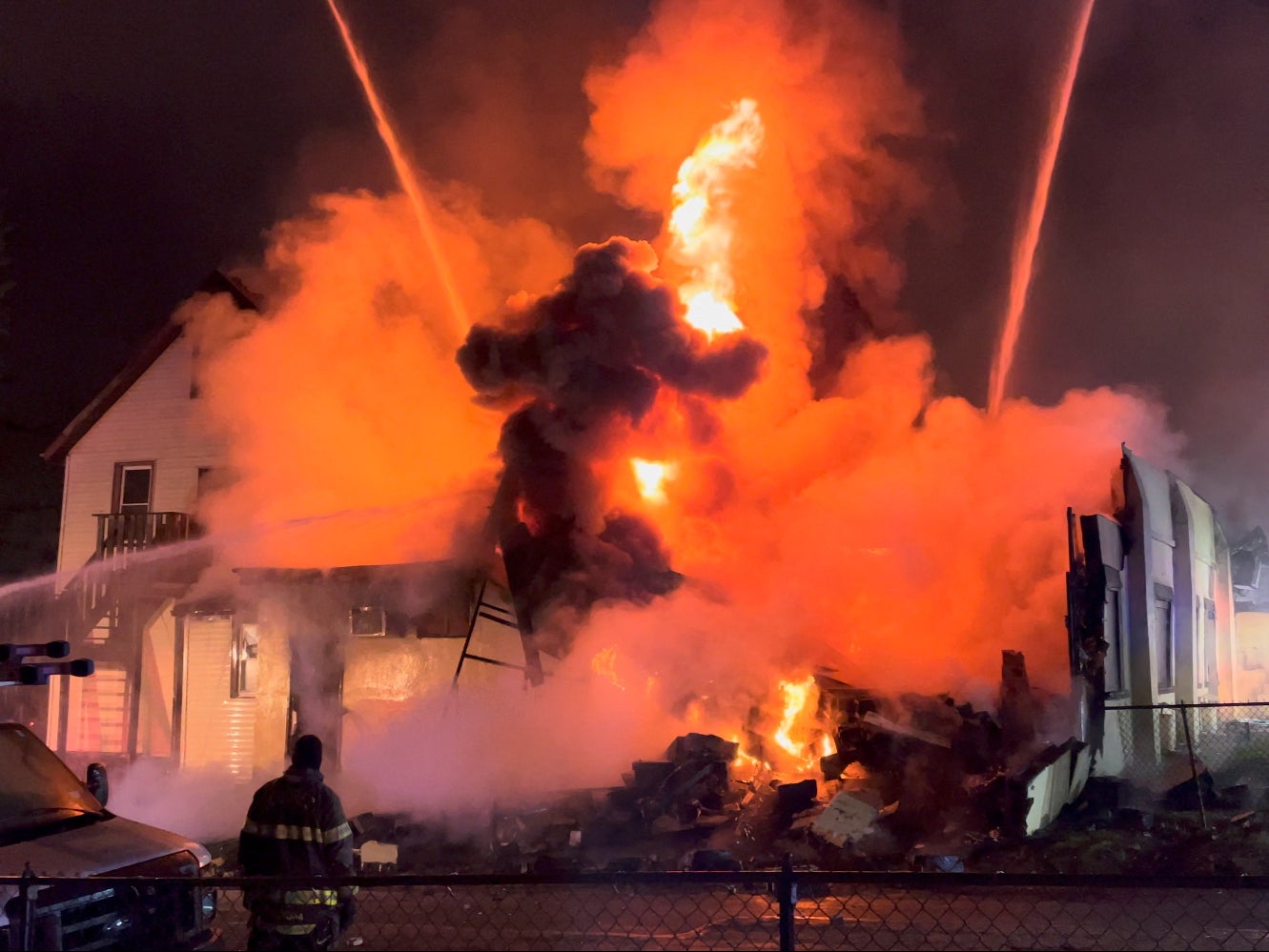 Firefighters extinguish a fire that broke out at Evergreen Nursing Home in Spring Valley, New York