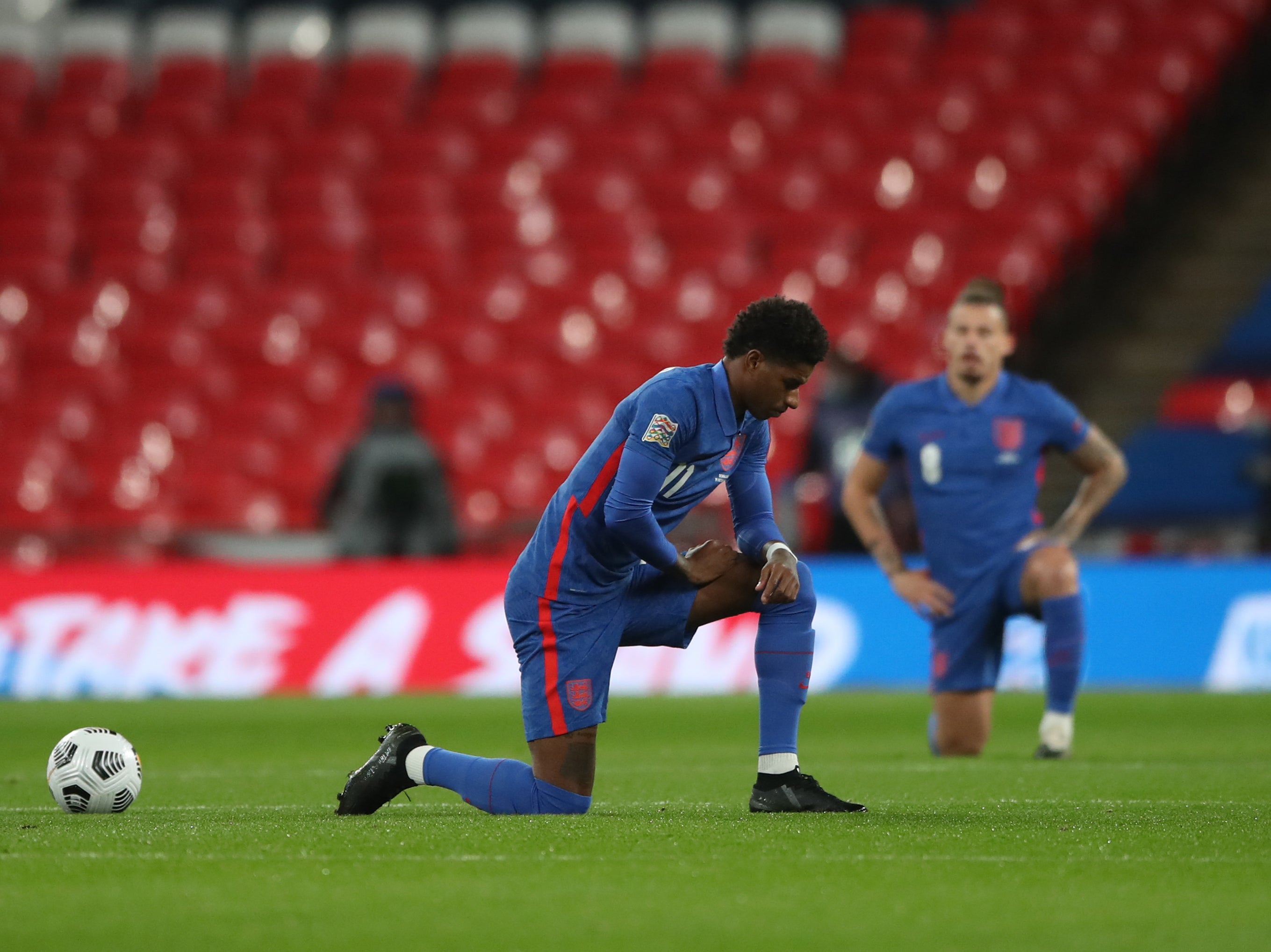 England players taking the knee before the match with Denmark